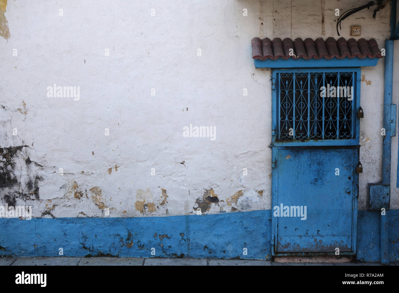 Old building with interesting blue door Stock Photo - Alamy