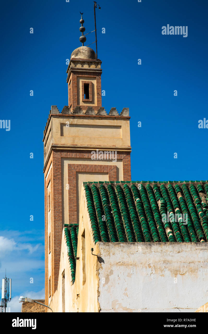 Morocco, Fes, Fes el Bali, Medina, minaret rising above low rise buildings Stock Photo