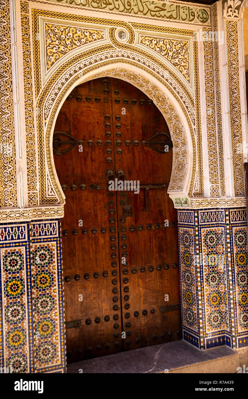 Morocco, Fes, Fes el Bali, Medina, Talaa Seghira, zellij decoration around wooden doorway Stock Photo