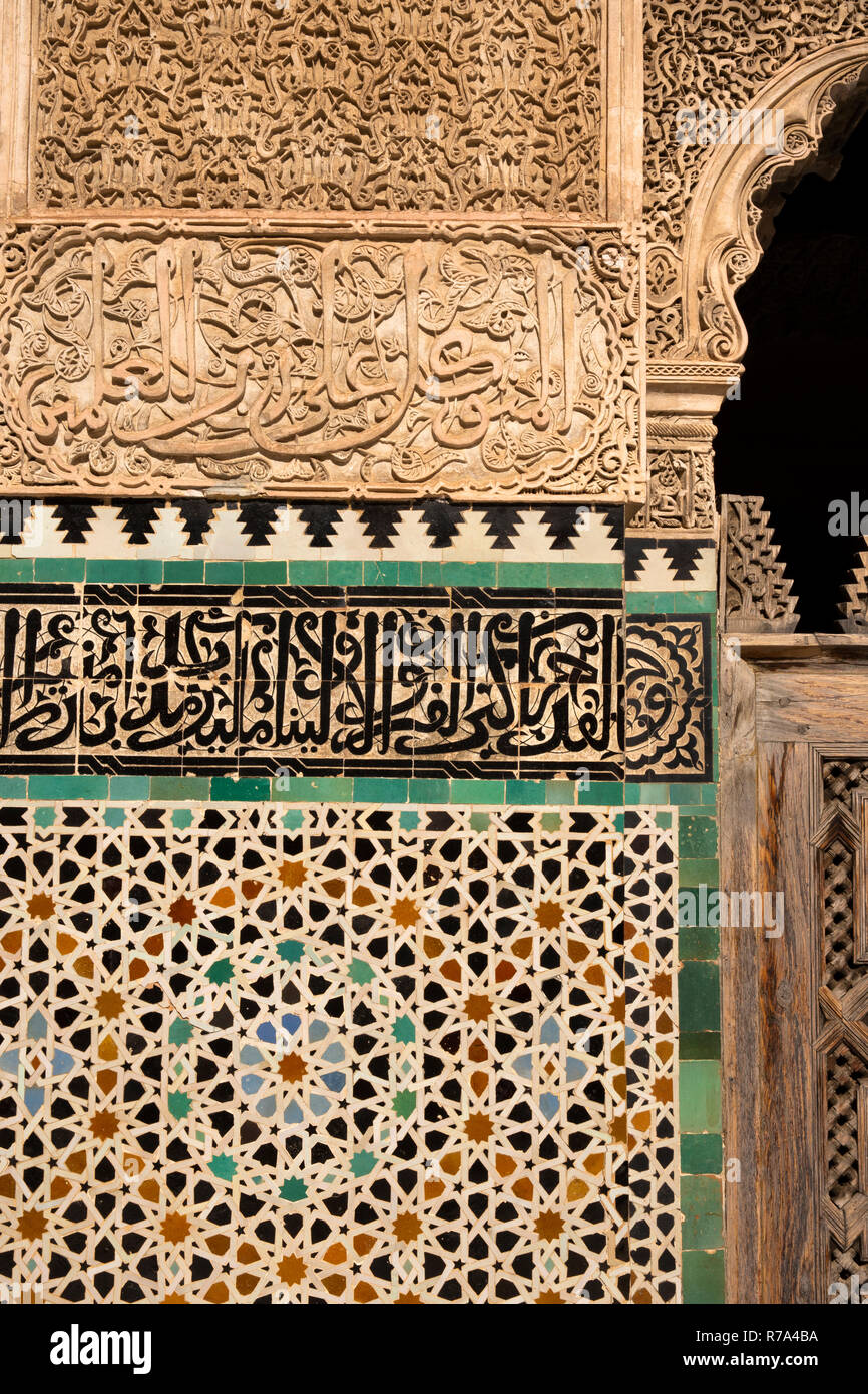 Morocco, Fes, Fes el Bali, Medina, Talaa Seghira, Medersa Bou Inania, incised plasterwork decoration and Koranic script Stock Photo
