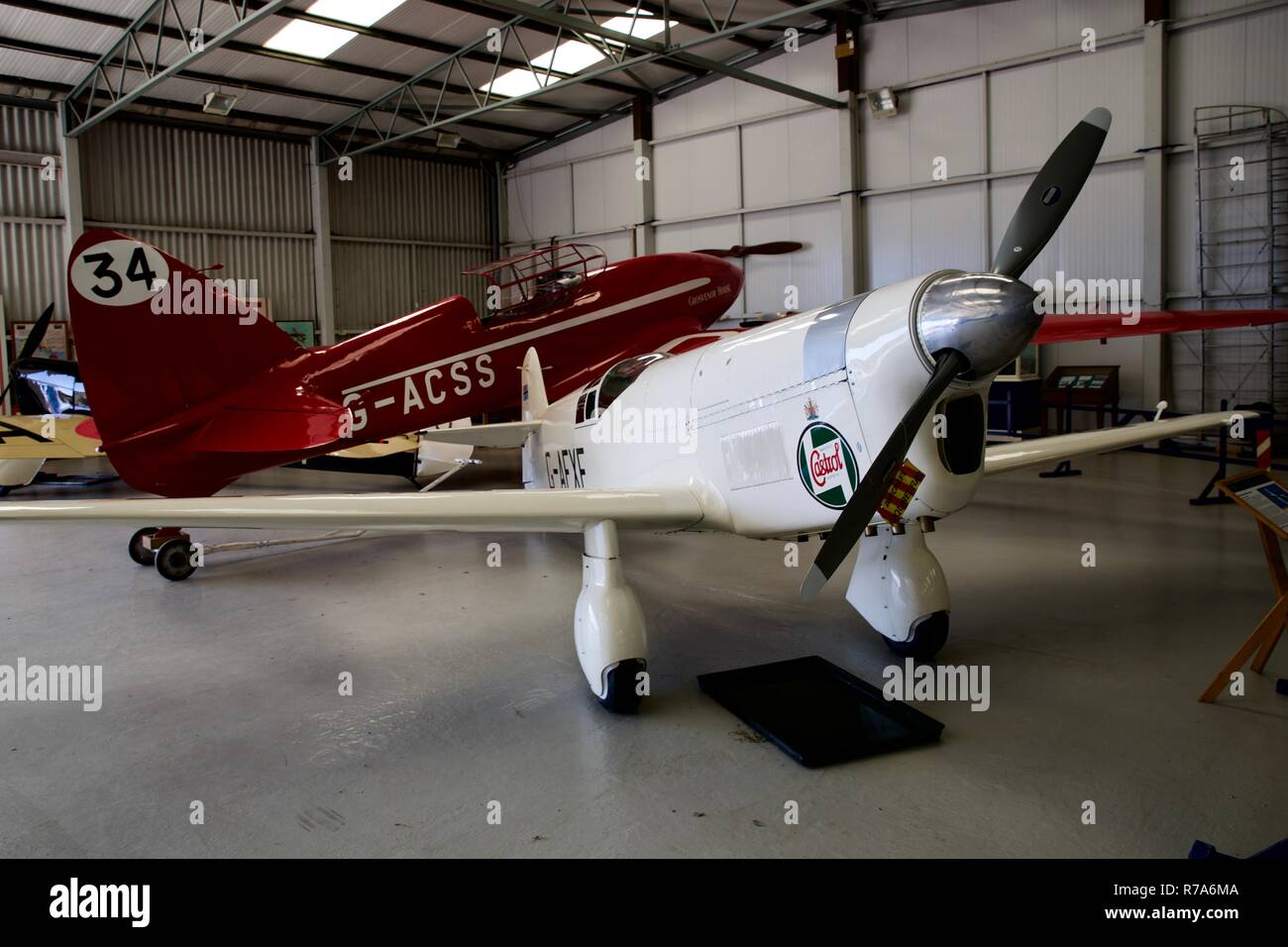 DH88 Comet (G-ACSS) and Percival Mew Gull (G-AEXF) on display in a aircraft hangar at Shuttleworth Stock Photo