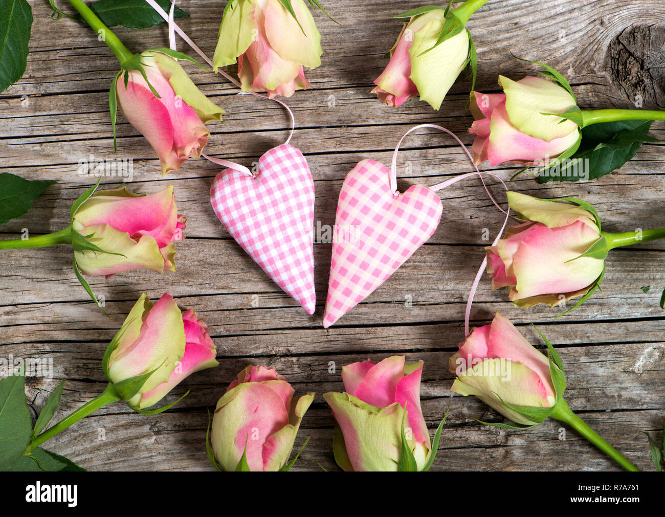 Two hearts petals roses hi-res stock photography and images - Alamy