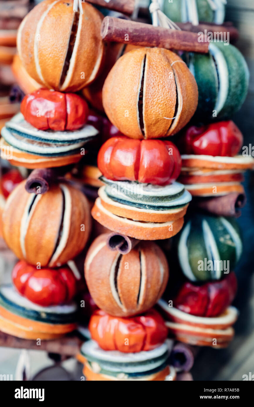 Colourful dried fruit Christmas garlands ( wreaths ) on sale at a
