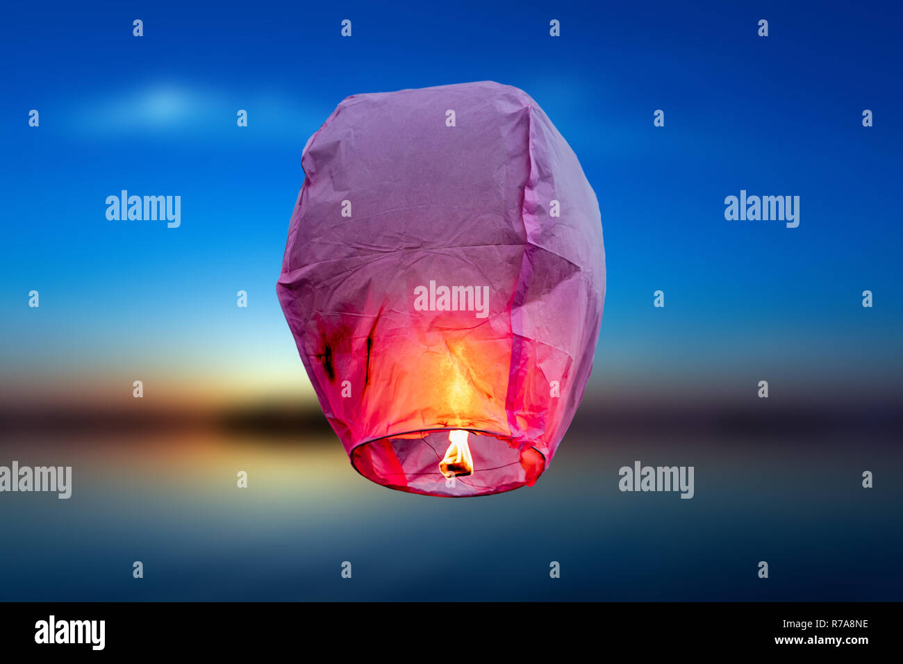 Balloon fire flying lanterns, hot-air balloons Lantern flies up highly in the sky. Stock Photo