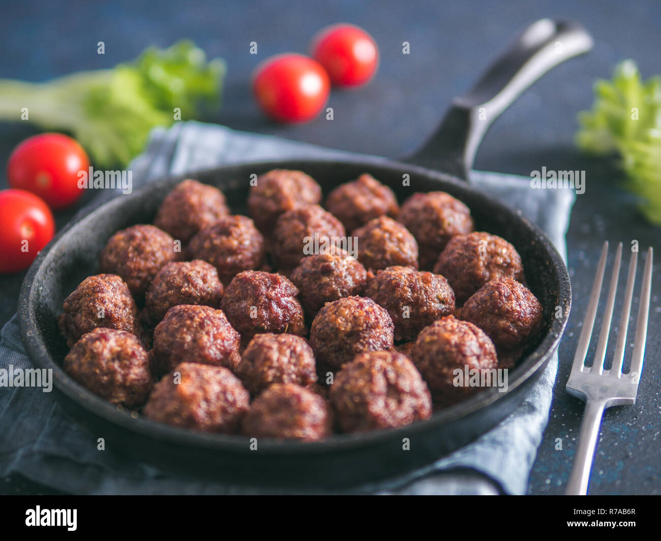 Homemade beef meatballs in castiron skillet Stock Photo Alamy