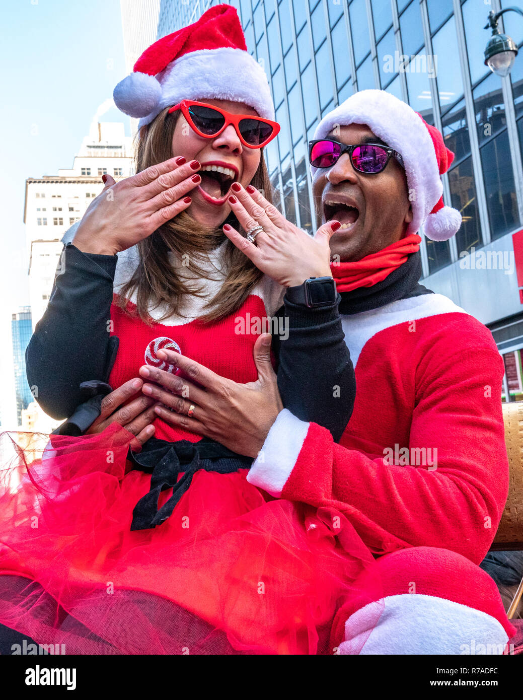 New York, USA, 8th December 2018. Revelers dressed as Santa Claus have fun during the annual SantaCon in New York City. Credit: Enrique Shore/Alamy Live News Stock Photo