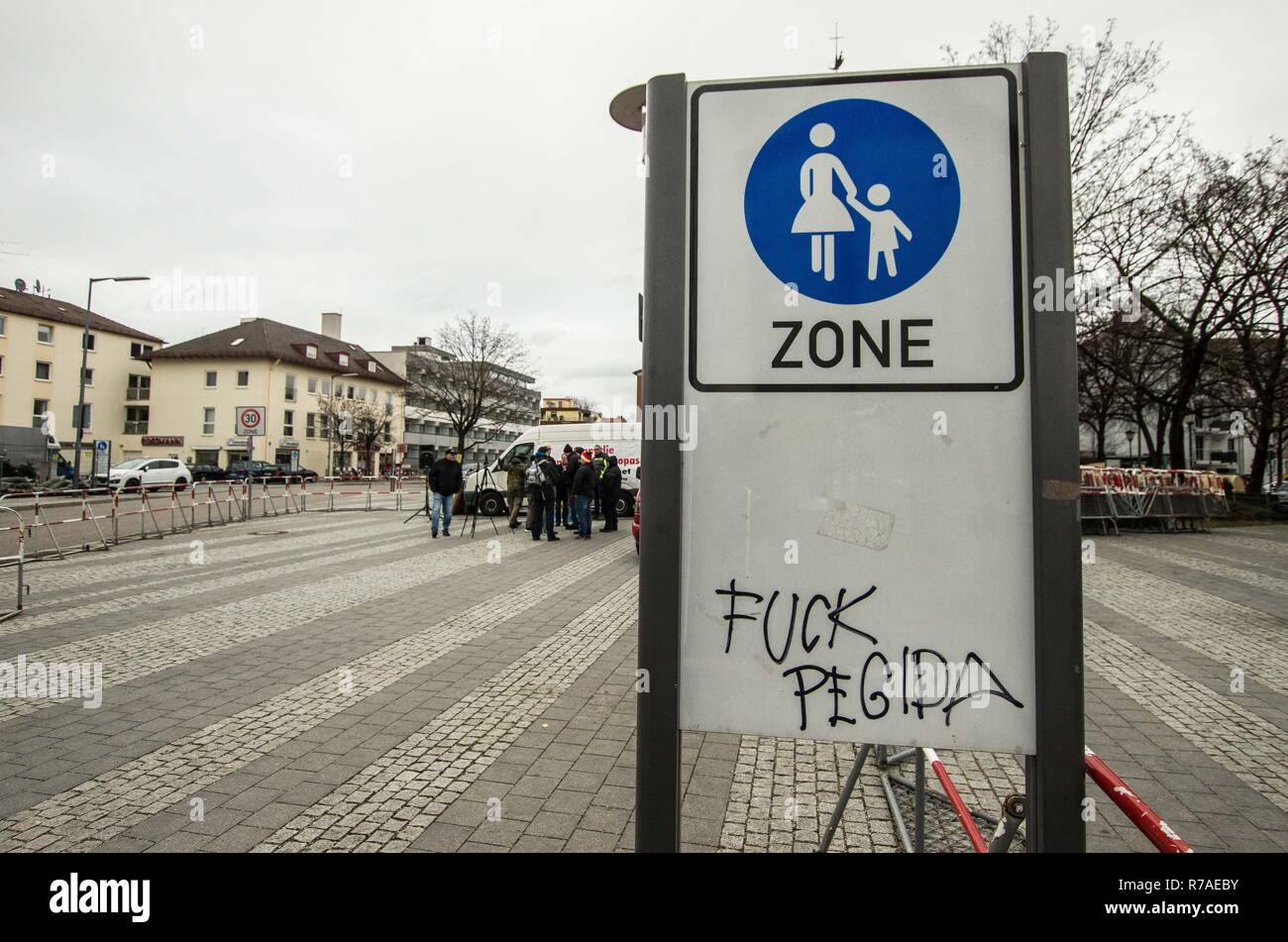 Munich, Bavaria, Germany. 8th December, 2018. Graffiti against the few from Pegida behind it. Pegida Dresden in Munich, the self-proclaimed original Pegida, organized a rally in the city's Milberthofen district in front of the Dankeskirche (Thanks Church) of Munich. Headed by Michael Stuerzenberger, the group rallied against the United Nations Migration Pact. Speaking with Stuerzenberger was Gernot Tegetmeyer f Credit Credit: ZUMA Press, Inc./Alamy Live News Stock Photo