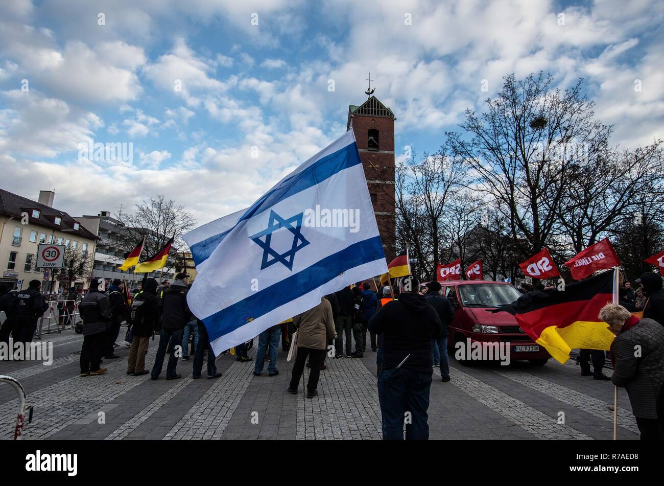 Munich, Bavaria, Germany. 8th December, 2018. A pro-Pegida demonstrator holds a Israeli flag. Pegida Dresden in Munich, the self-proclaimed original Pegida, organized a rally in the city's Milberthofen district in front of the Dankeskirche (Thanks Church) of Munich. Headed by Michael Stuerzenberger, the group rallied against the United Nations Migration Pact. Speaking with Stuerzenberger was Gernot Tegetmeyer Credit: Credit: ZUMA Press, Inc./Alamy Live News Stock Photo