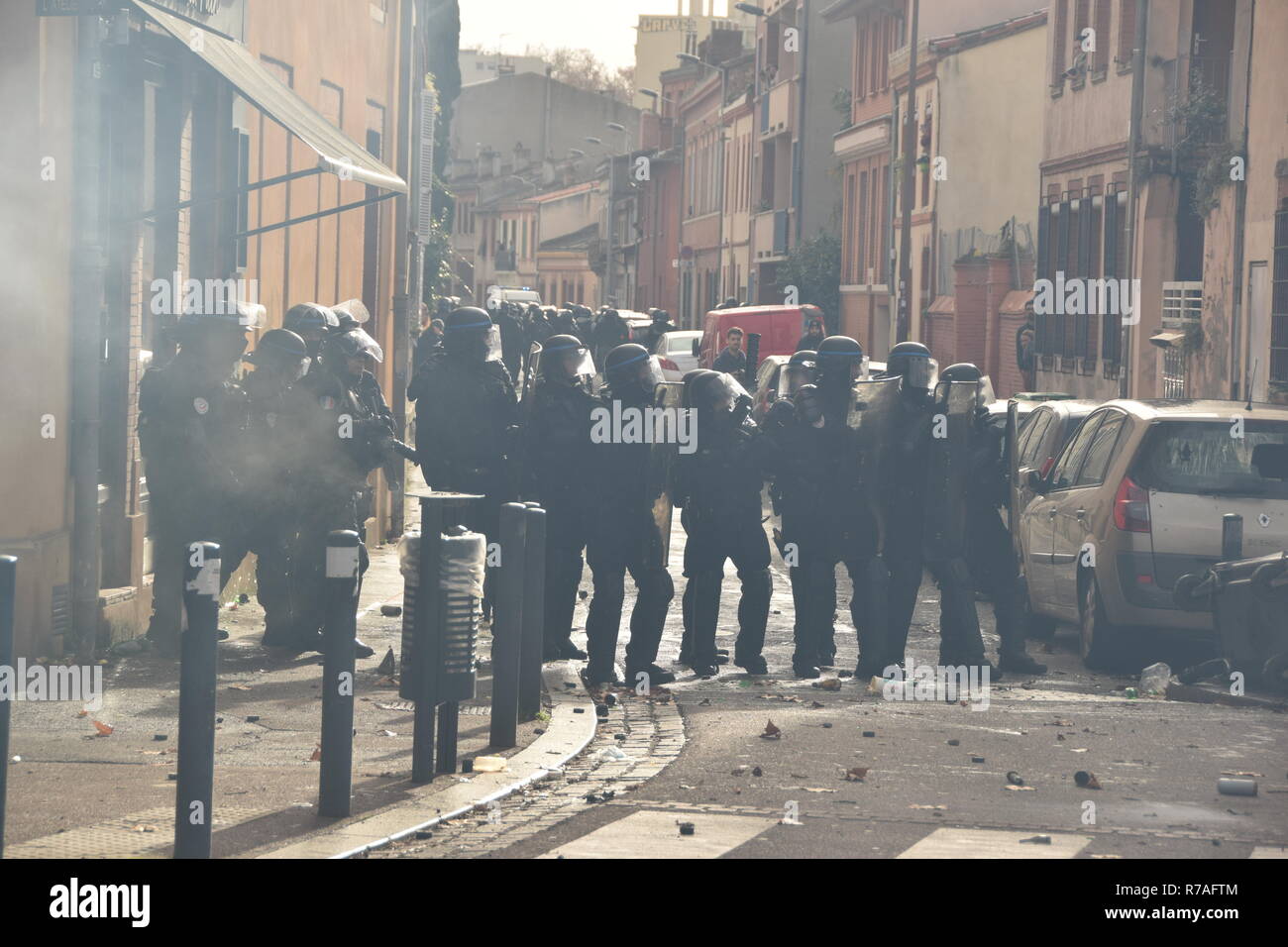 Serious clashes occured on December the 8th in the streets of Toulouse, France, between riot police units and the yellow vest (gilets jaunes). Police largely used tear gas. Such violences occured all over France. These violences are due to high taxes, low salaries, poverty, inemployment, etc... over the past decades. Stock Photo