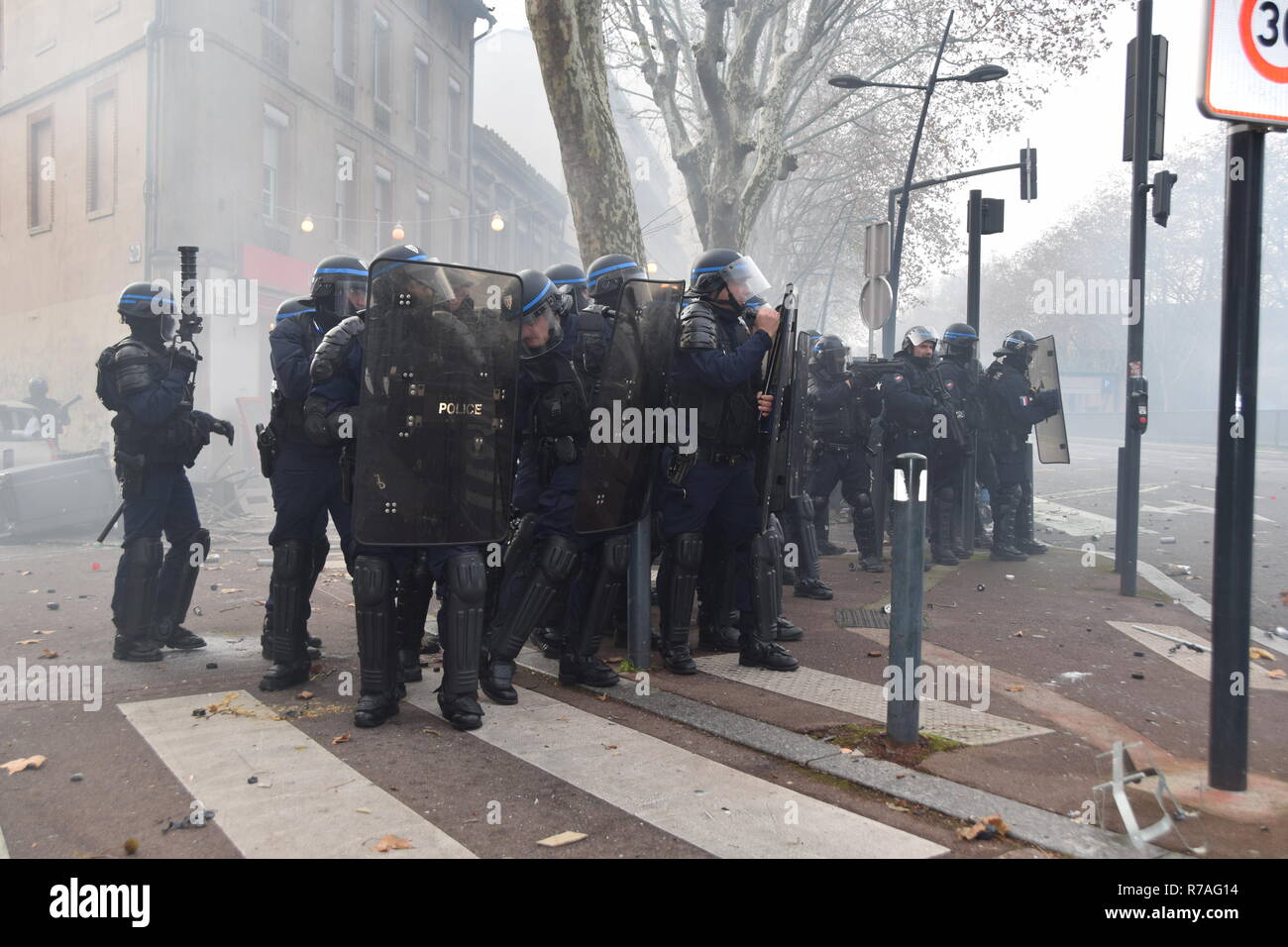 Serious clashes occured on December the 8th in the streets of Toulouse, France, between riot police units and the yellow vest (gilets jaunes). Police largely used tear gas. Such violences occured all over France. These violences are due to high taxes, low salaries, poverty, inemployment, etc... over the past decades. Stock Photo