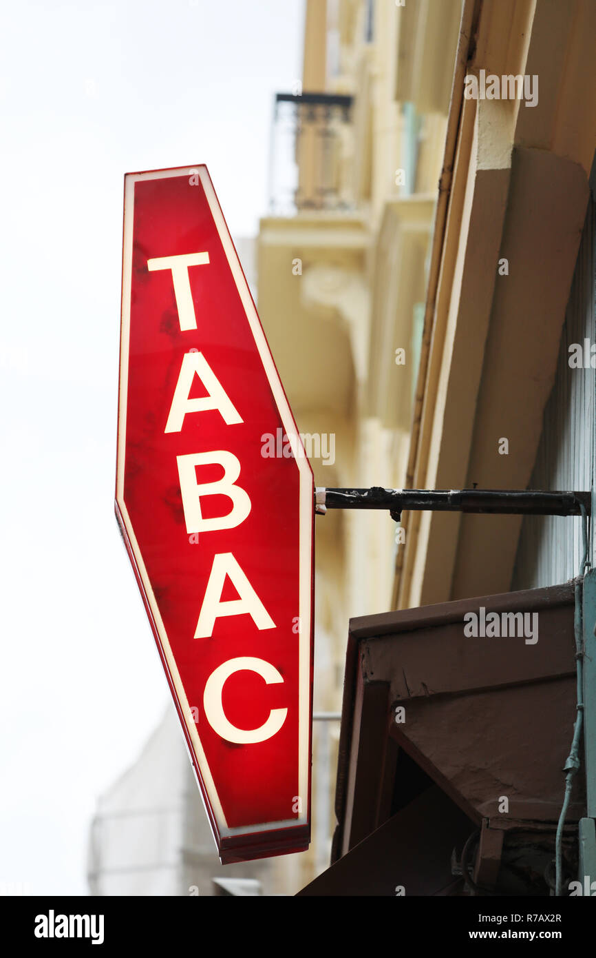 Illuminated French Red And White Sign Tabac. In France 'Tabac' Means Tobacco Stock Photo