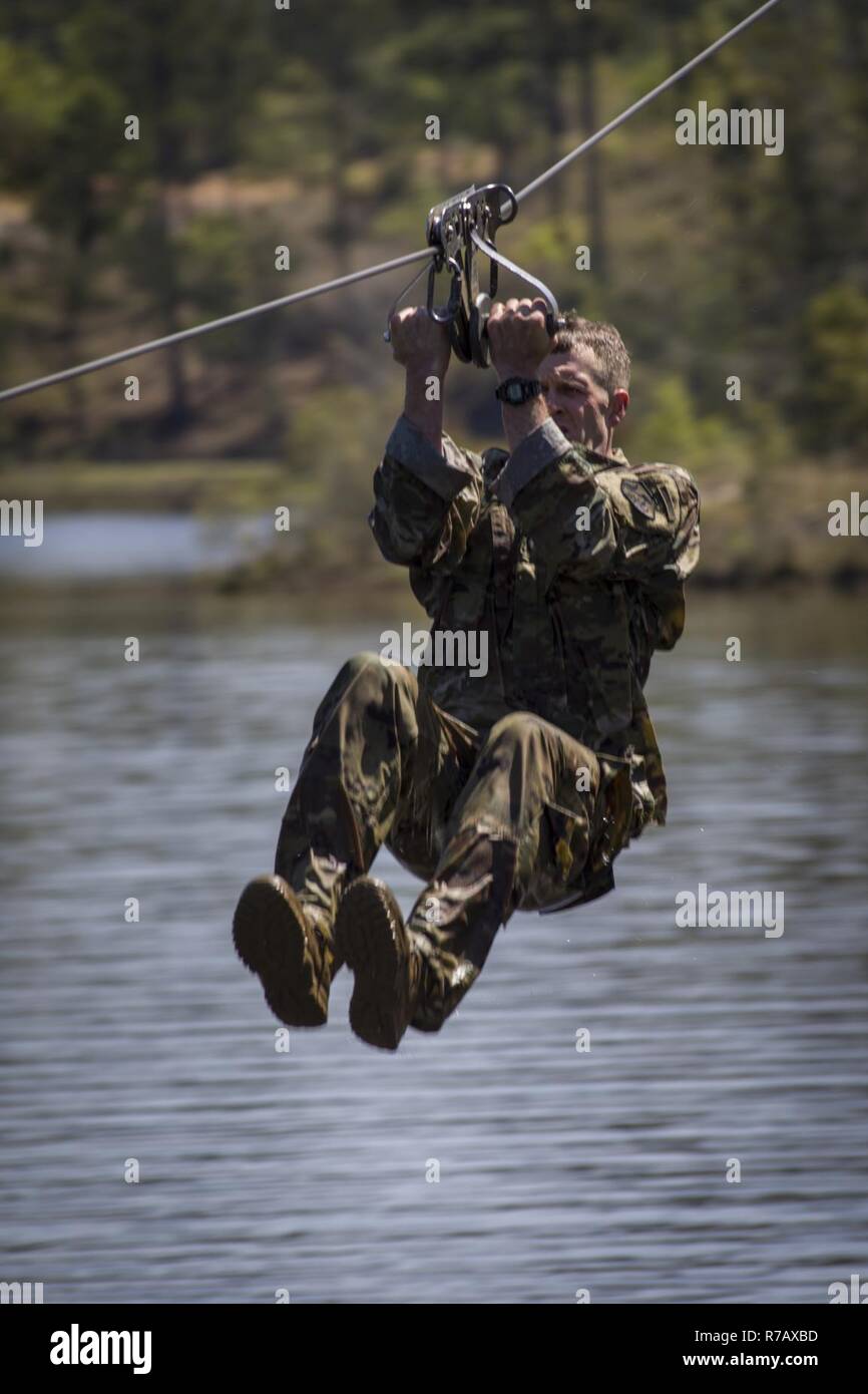 A U.S. Army Ranger performs the "slide for life" zipline at the Combat