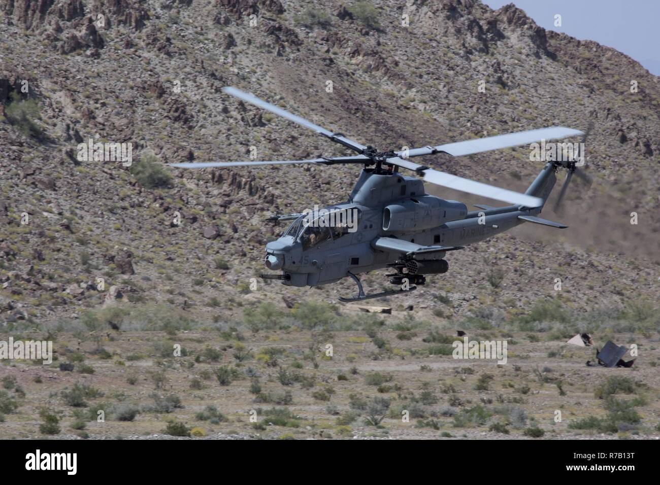 A U.S. Marine Corps AH-1Z Viper assigned to Marine Aviation Weapons and Tactics Squadron One (MAWTS-1) engages targets during offensive air support exercise (OAS) 5 in support of Weapons and Tactics Instructor course (WTI) 2-17 at Chocolate Mountain Aerial Gunnery Range, Ariz., April 11, 2017. OAS is designed to focus on the integration of all air combat element aviation assets with a developed ground scheme of maneuver to conduct close air support. WTI is a seven-week training event hosted by MAWTS-1 cadre, which emphasizes operational integration of the six functions of Marine Corps aviation Stock Photo
