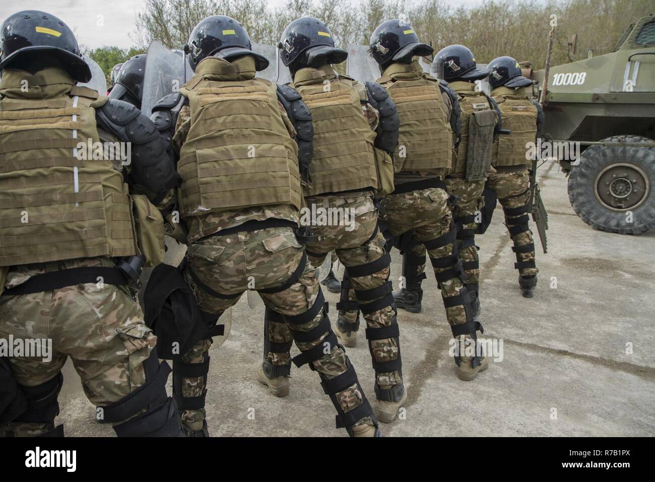 Kosovo Force soldiers from Slovenia stand ready as they begin their ...