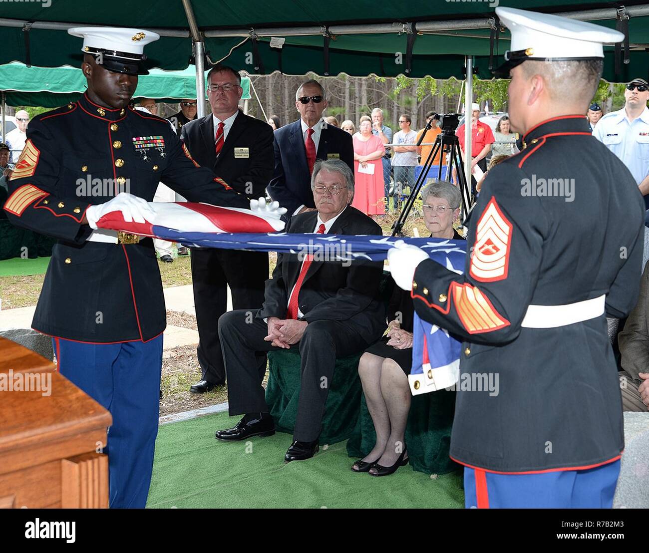 Master Sgt. Jeremy Singleton, left, and Master Sgt. Robert Nolasco fold