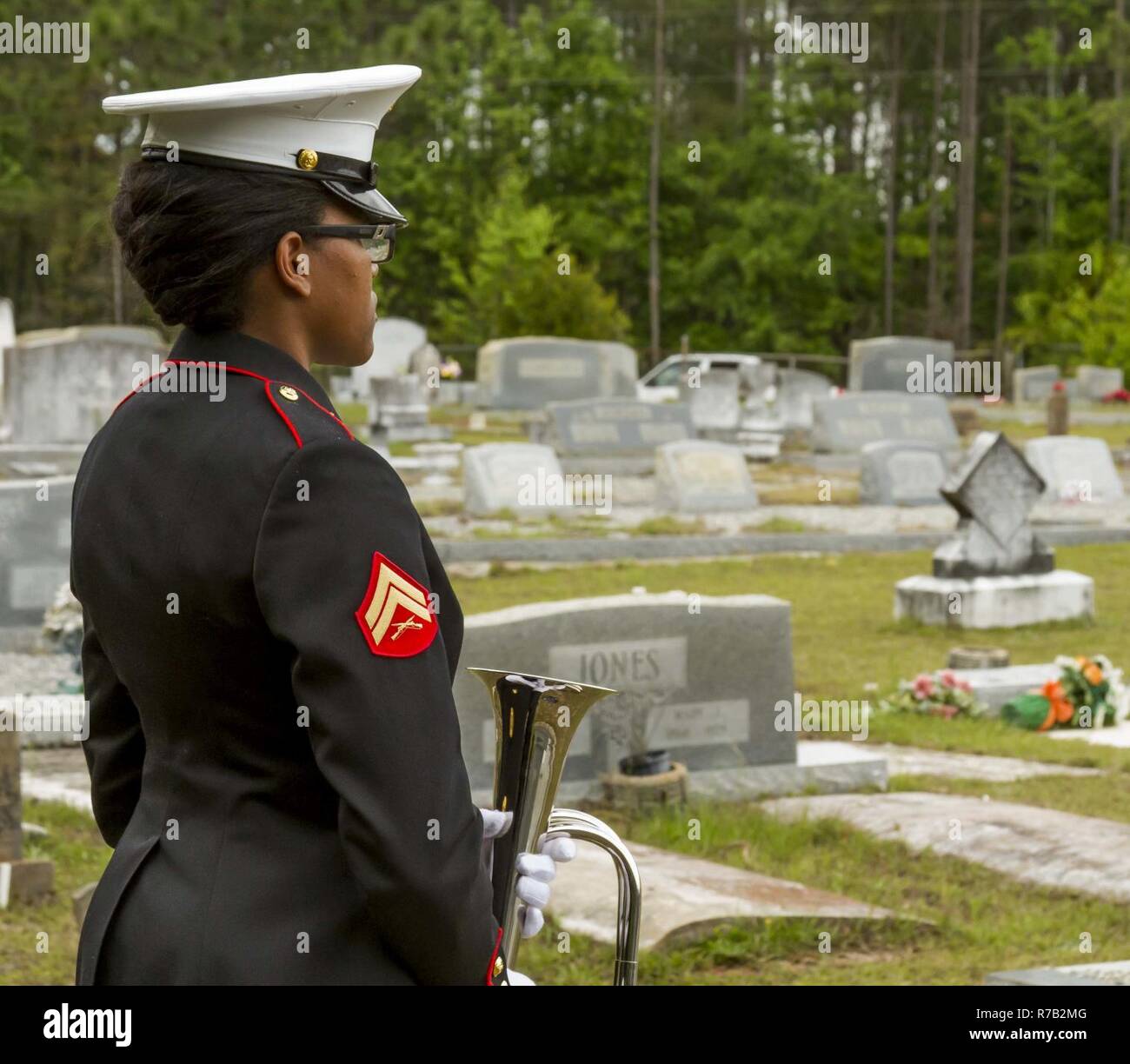A Marine with Marine Corps Logistics Base Albany funeral detail waits