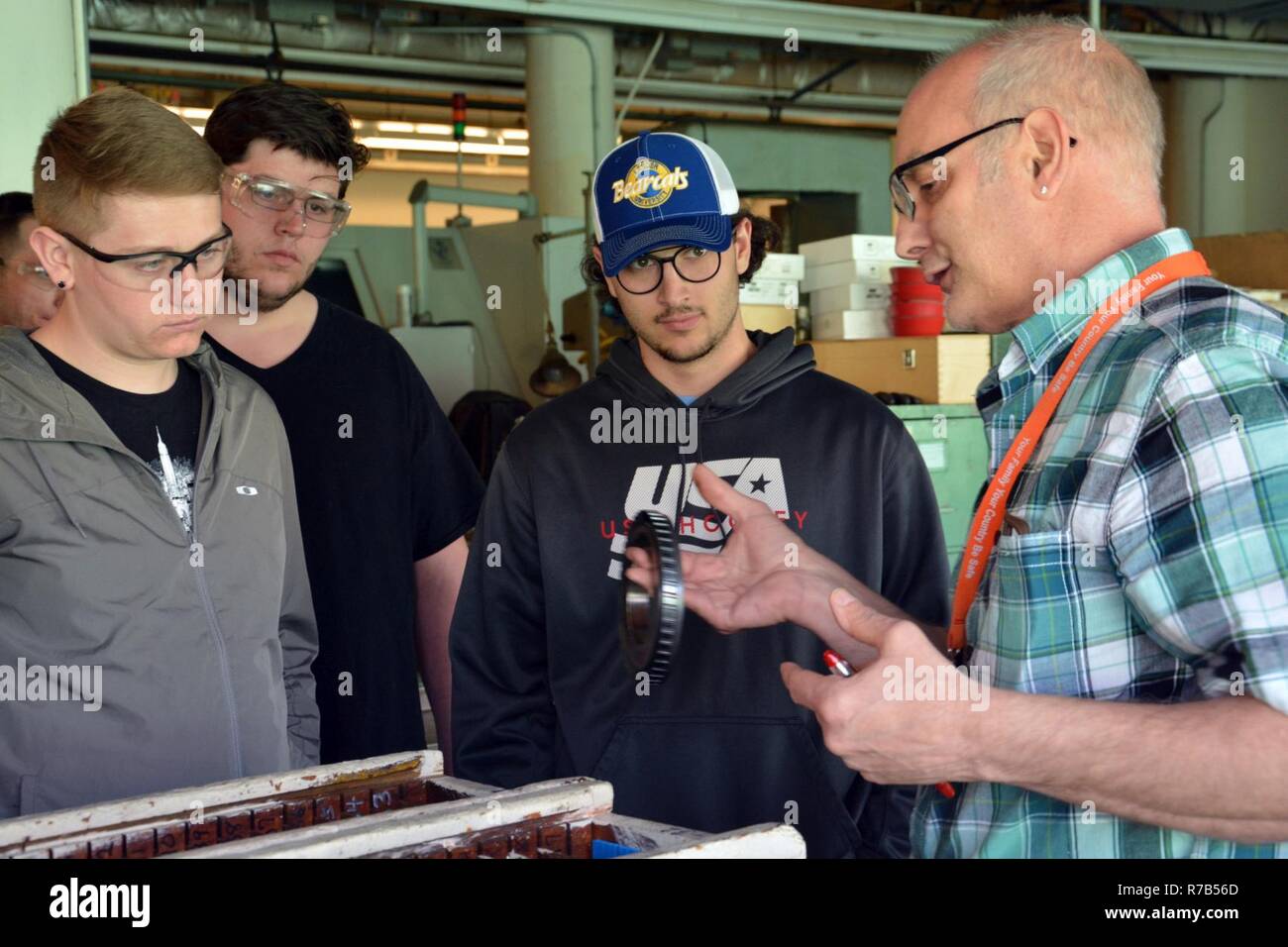 Arsenal Tool Room Supervisor Anthony Polsinelli, right, explaining how