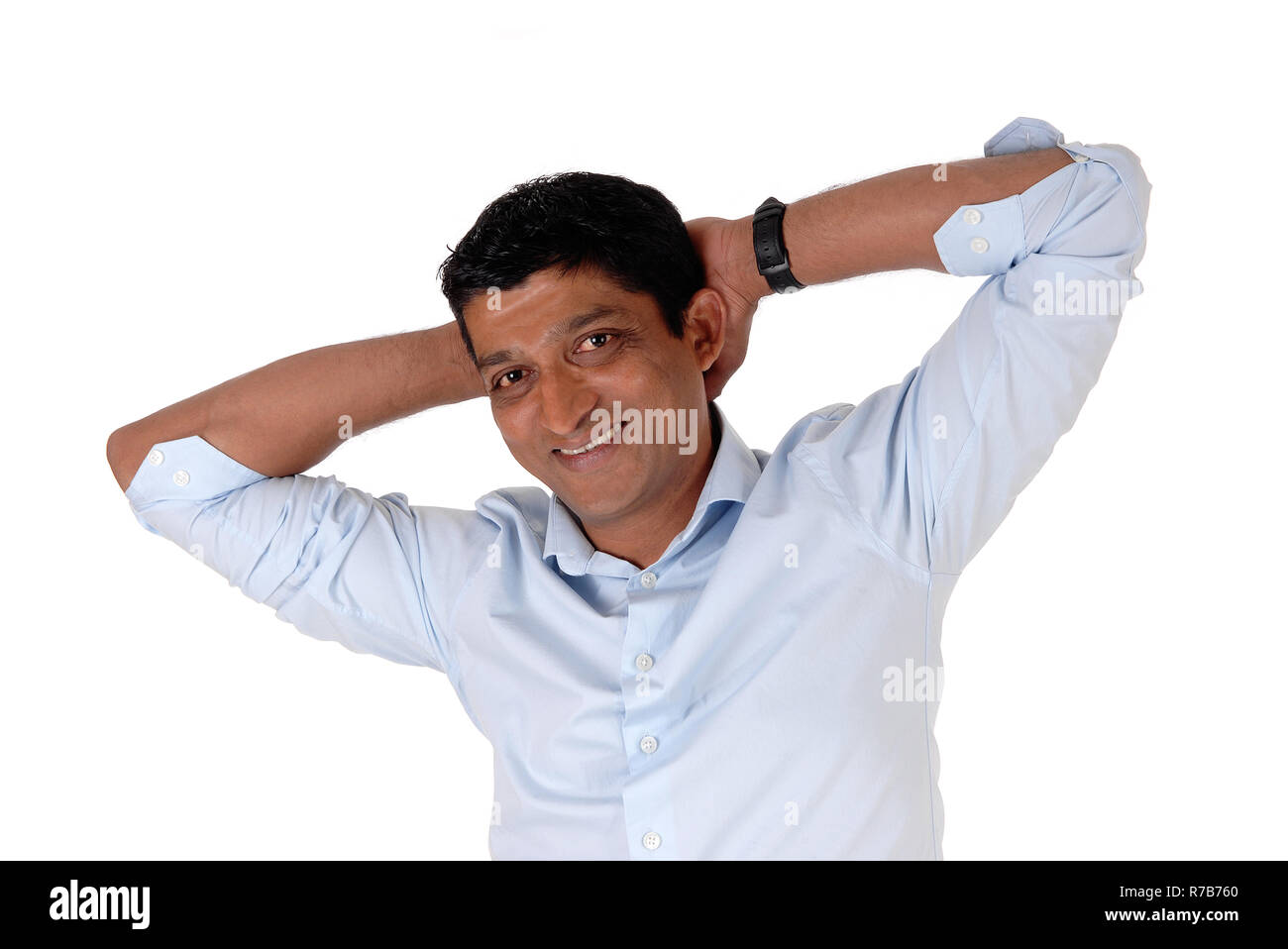 Closeup on a Indian man hands behind his head Stock Photo