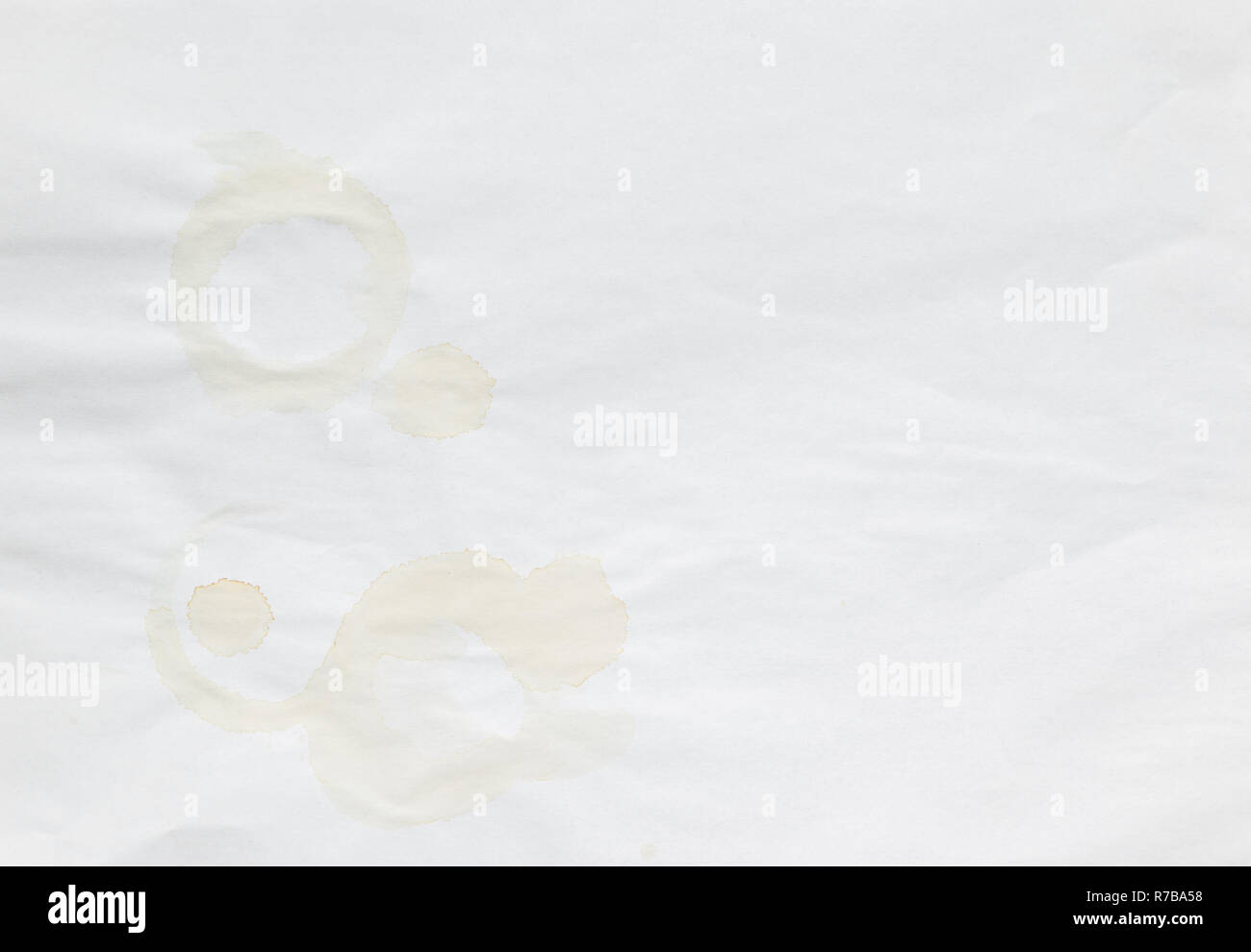 Full frame background of faded coffee cup stains on an old and uneven ...