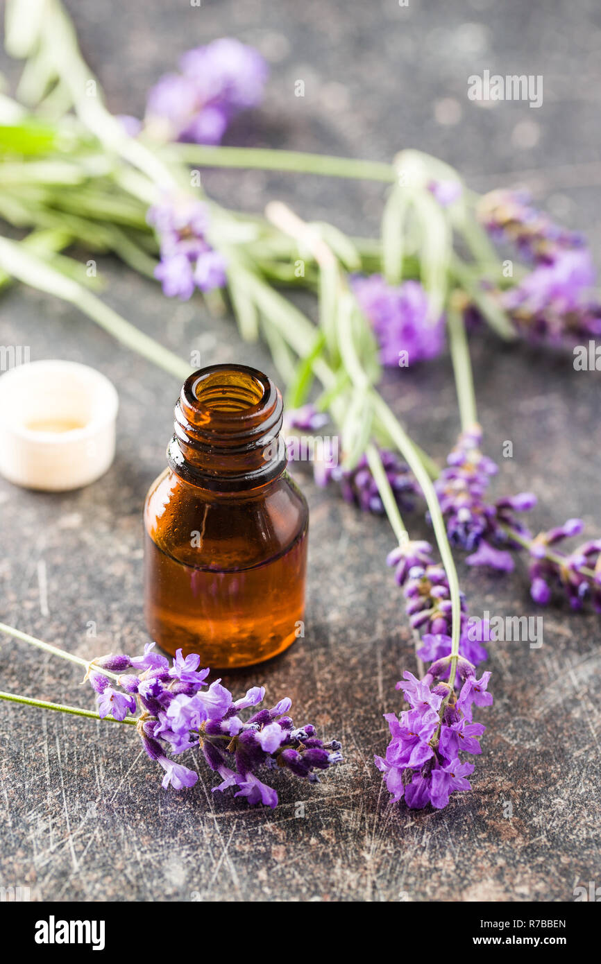 Essential oil and lavender flowers Stock Photo - Alamy