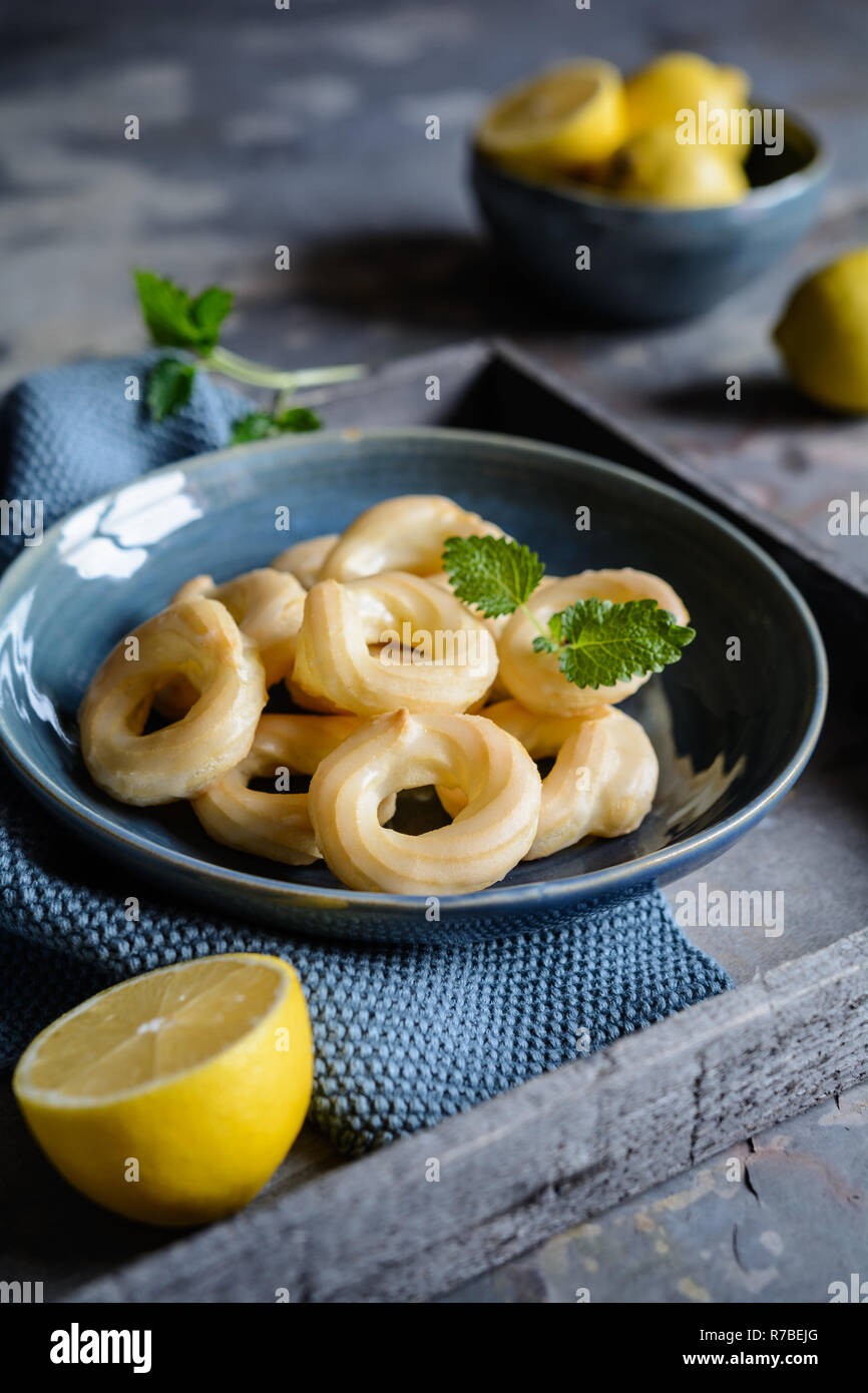 Traditional French Cruller Donuts with lemon glaze Stock Photo