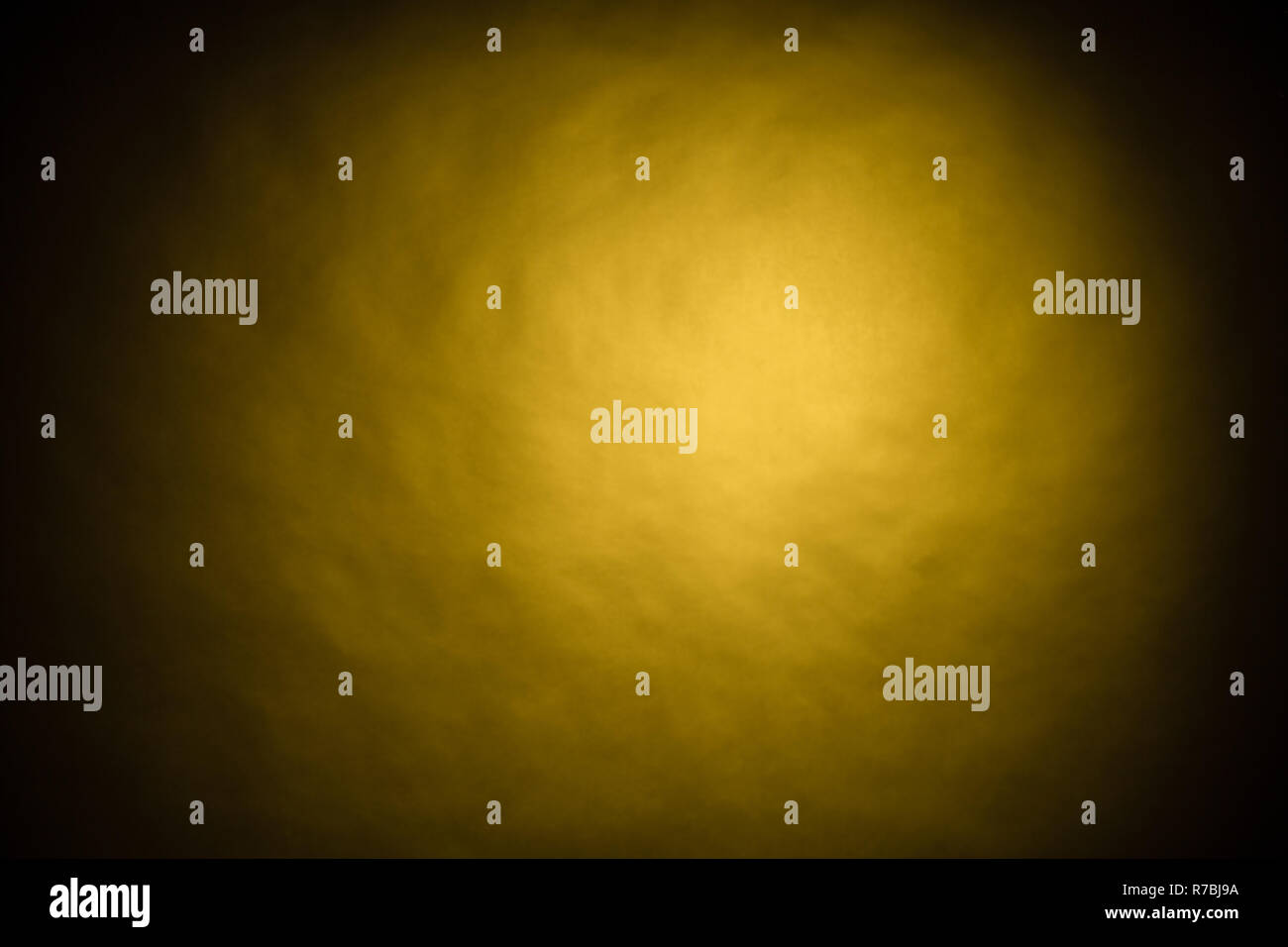 Yellow light on black background in photo studio Stock Photo Alamy