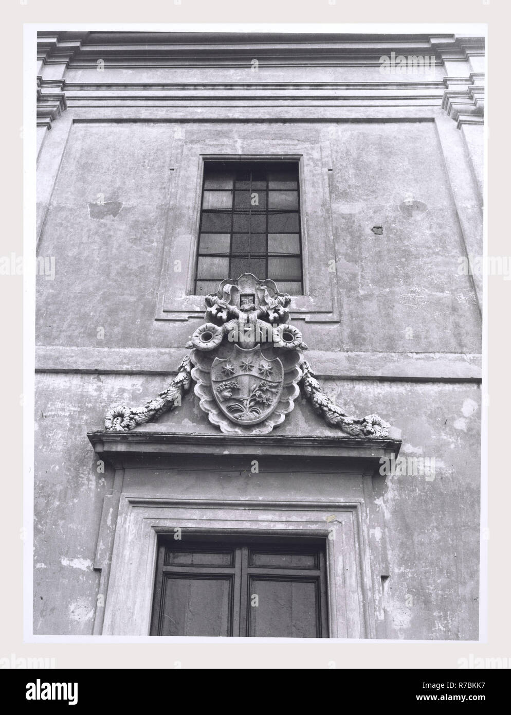 Lazio Roma Palidoro SS. Filippo e Giacomo Apostoli, this is my Italy, the italian country of visual history, Post-medieval Architecture, architectural sculpture. Views of facade of parrocchiale, with coat-of-arms over the main portal. Stock Photo