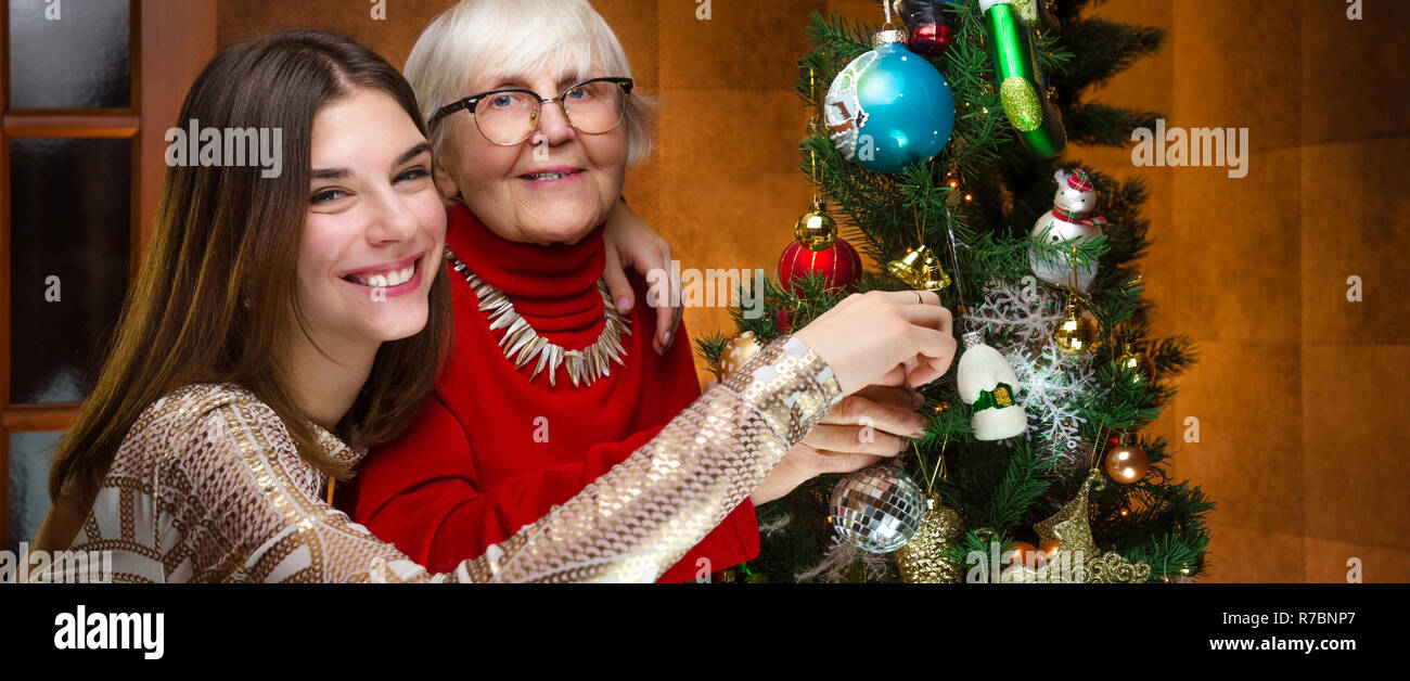 new year. senior grandma and young caucasian woman, teenager Stock Photo