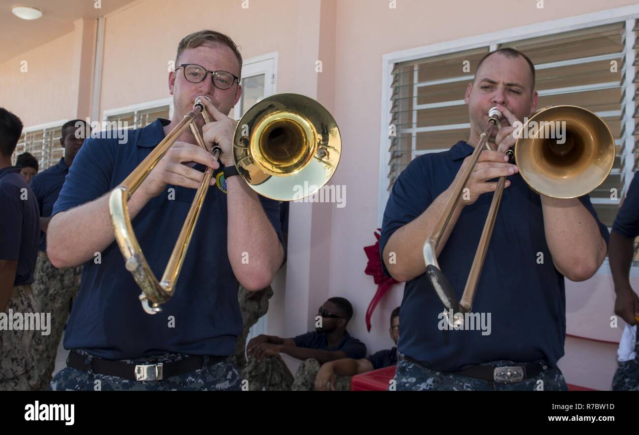 DA NANG, Vietnam (May 12, 2017) Musician 2nd Class Chris Lang (left) and Musician 2nd Class James Brownell (right) of the U.S. 7th Fleet Band, Far East Edition, play trombones at the ribbon cutting ceremony for the Hoa Lien Nursery School during Pacific Partnership 2017 Da Nang May 12. Pacific Partnership is the largest annual multilateral humanitarian assistance and disaster relief preparedness mission conducted in the Indo-Asia-Pacific and aims to enhance regional coordination in areas such as medical readiness and preparedness for manmade and natural disasters. Stock Photo