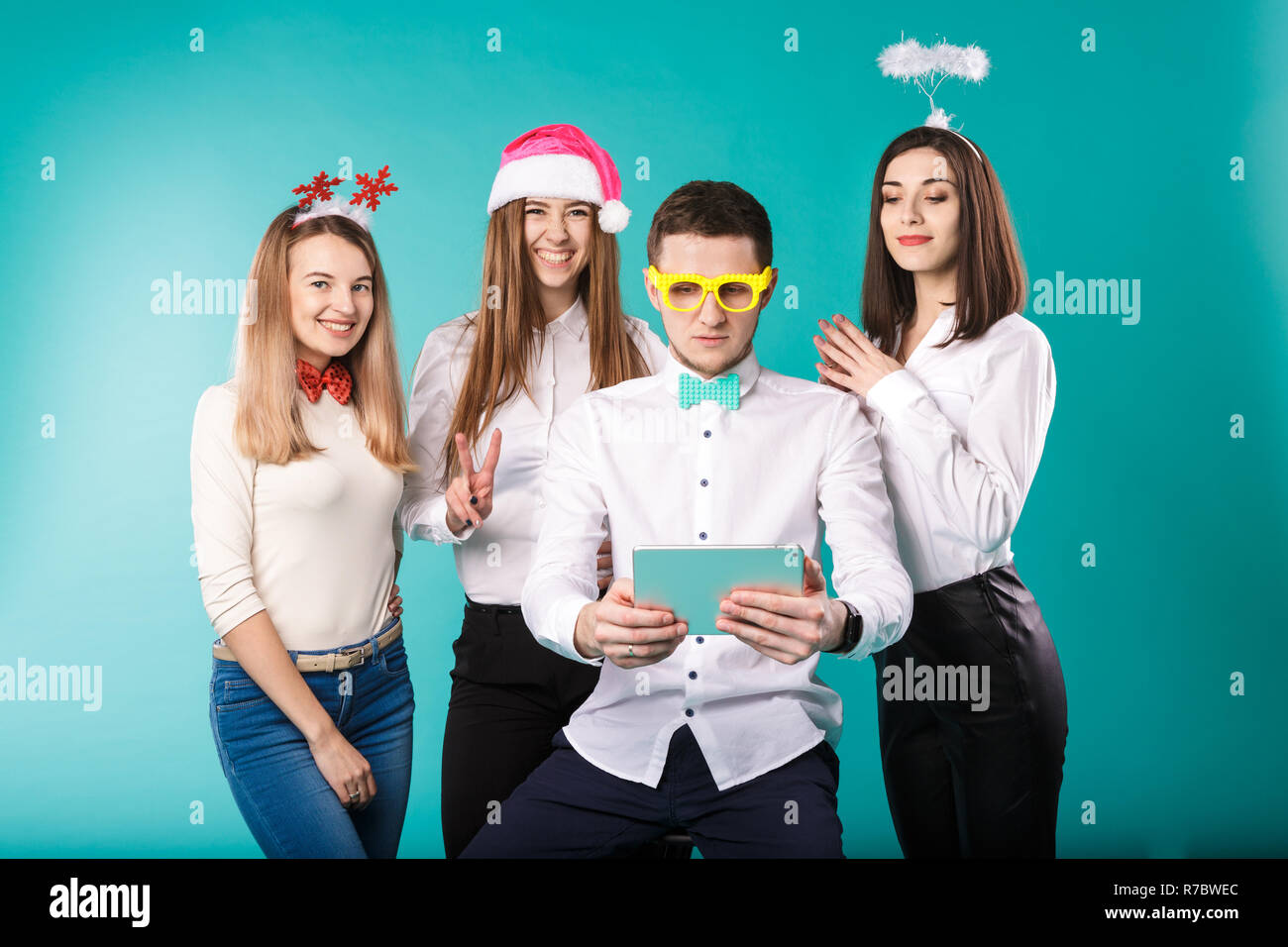 New Year Theme Christmas Winter Office Company Employees Group 4 Young Caucasian People Business Smile Holiday Funny Hats Accessories Glasses Take Ph Stock Photo Alamy