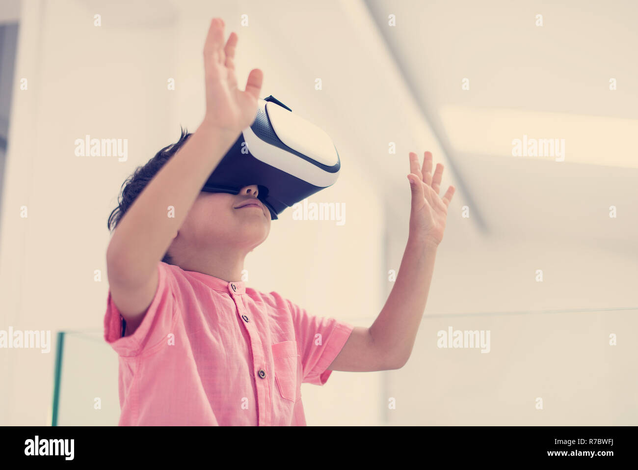 Kid At Home Wearing Vr Glasses Putting Hands Up And Playing Games
