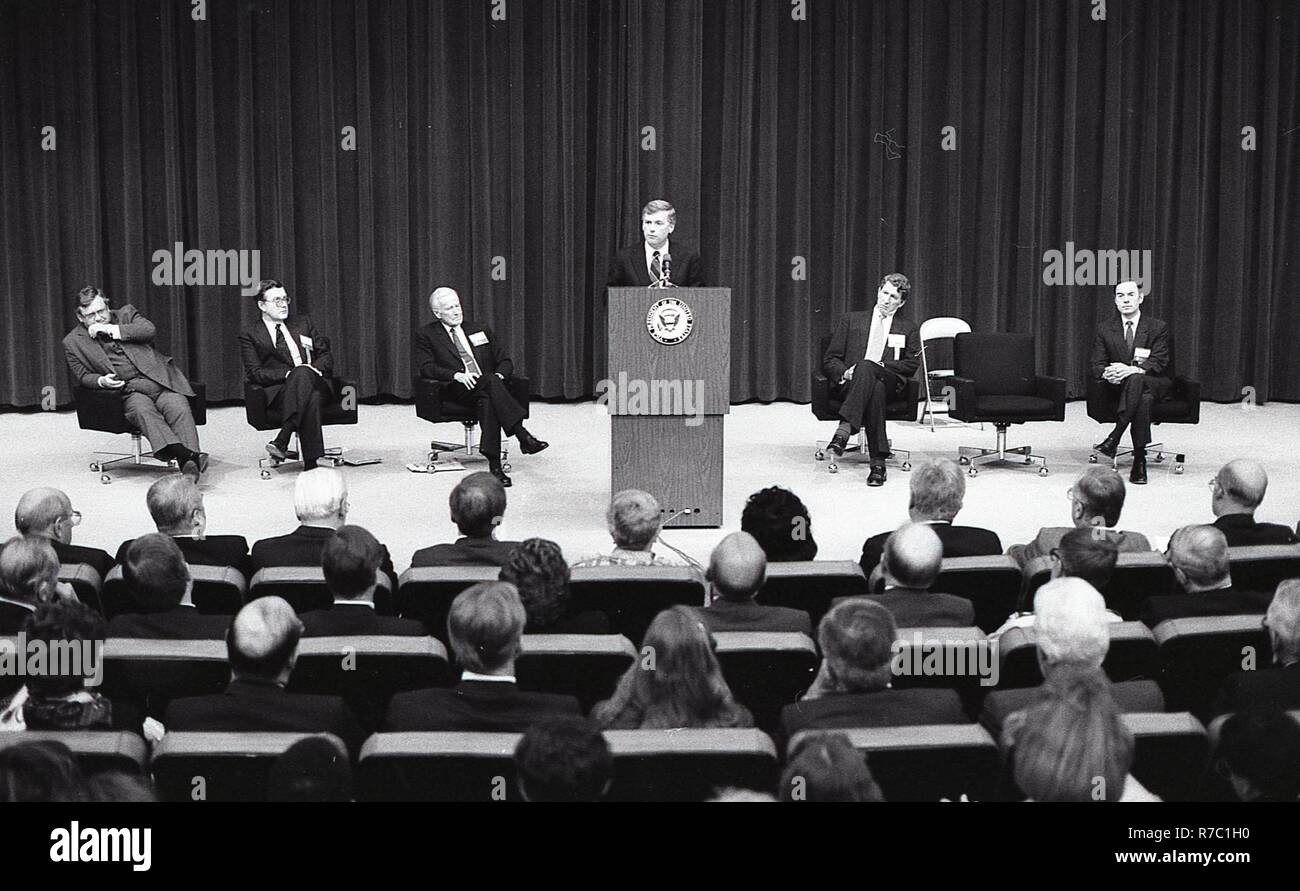 THERE IS A MAN AT THE PODIUM GIVING A SPEECH TO A GROUP OF MEN AND ...