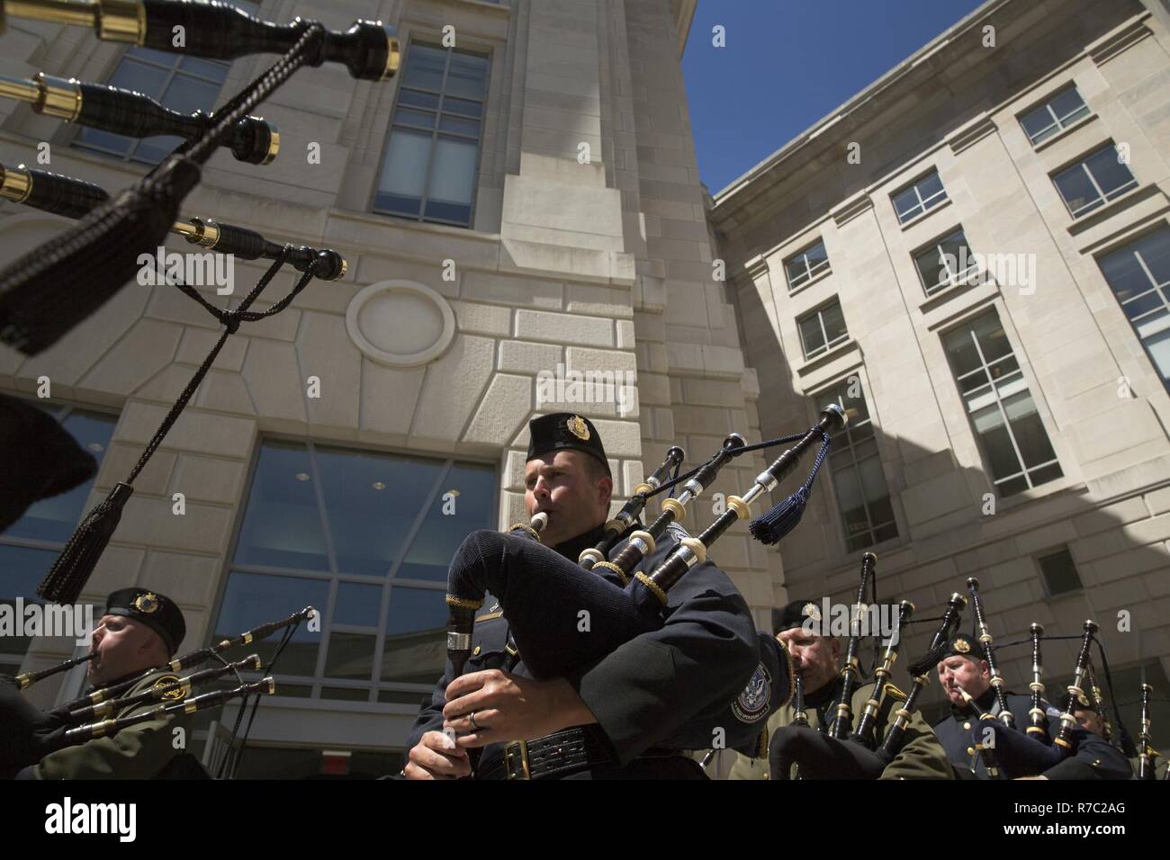 Bagpipes players with the U.S. Border Patrol Pipes and Drums march into position during the U.S. Customs and Border Protection Valor Memorial and Wreath Laying Ceremony in Woodrow Wilson Plaza at the Ronald Reagan Building in Washington, D.C., May 16, 2017. U.S. Customs and Border Protection Stock Photo