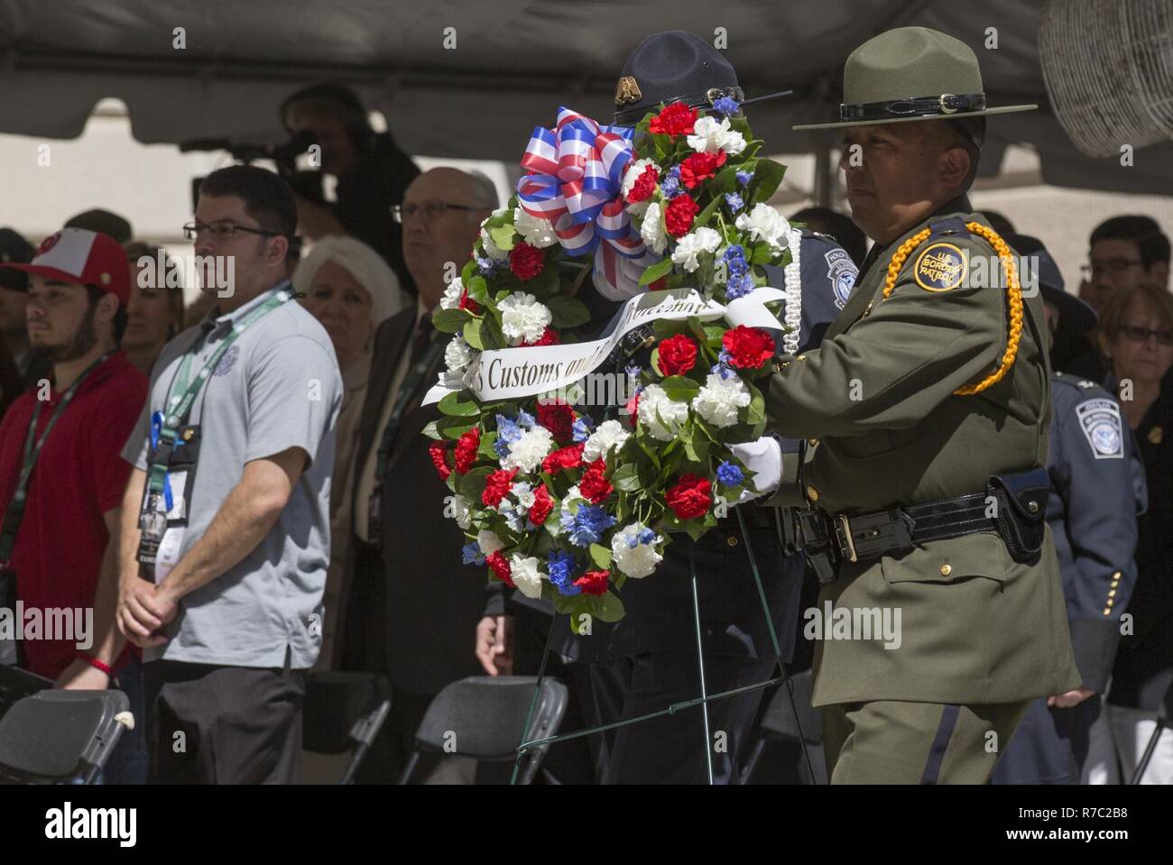 U.S. Border Patrol Agents carry a wreath to the stage during the U.S. Customs and Border Protection Valor Memorial and Wreath Laying Ceremony in the Woodrow Wilson Plaza of the Ronald Reagan Building in Washington, D.C., May 16, 2017. U.S. Customs and Border Protection Stock Photo