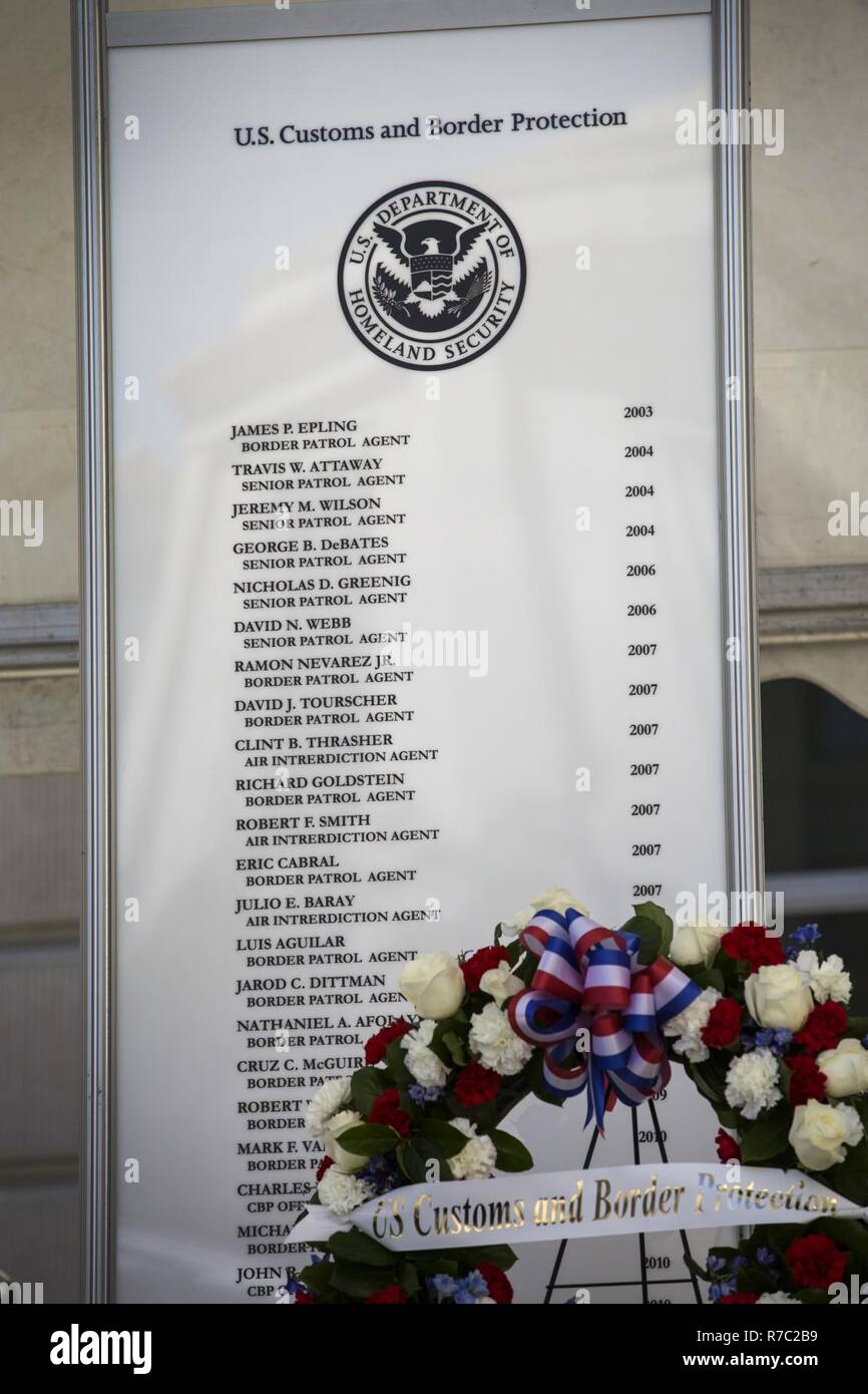 A section of a memorial wall with four new names added to it is unveiled on stage during the U.S. Customs and Border Protection Valor Memorial and Wreath Laying Ceremony in the Woodrow Wilson Plaza of the Ronald Reagan Building  in Washington, D.C., May 16, 2017. Four U.S. Added to the list are U.S. Border Patrol Agents Manuel Alvarez, Jose D. Barraza, David Gomez and Javier J. Vega Jr. U.S. Customs and Border Protection Stock Photo