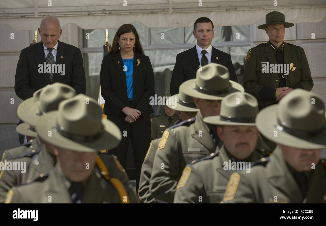 From left, Secretary of Homeland Security John Kelley, Deputy Secretary of Homeland Security Elaine C. Duke, U.S. Customs and Border Protection Acting Commissioner Kevin K. McAleenan and U.S. Customs and Border Protection Acting Deputy Commissioner Ronald D. Vitiello stand as a roll call of fallen officers and agents is announced during the U.S. Customs and Border Protection Valor Memorial and Wreath Laying Ceremony in the Woodrow Wilson Plaza outside the Ronald Reagan Building in Washington, D.C., May 16, 2017. U.S. Customs and Border Protection Stock Photo