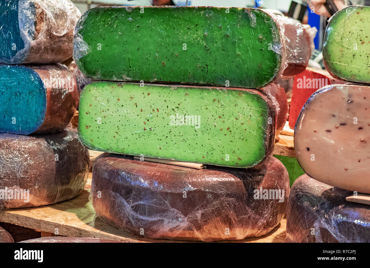 artisan cheeses flavored with natural pigments that give bright colors Stock Photo