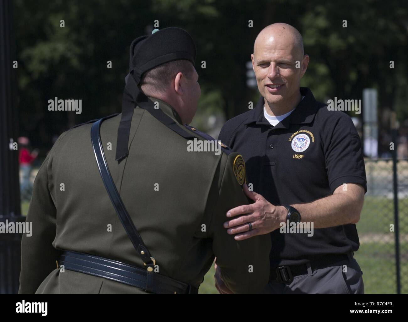 U.S. Customs and Border Protection Acting Deputy Commissioner Ronald D. Vitiello congratulates the commander of the the U.S. Border Patrol Pipes and Drums Rich Fortunato after the team performed in the Steve Young Honor Guard Pipes and Drums Competition in Washington, D.C., May 14, 2017. U.S. Customs and Border Protection Stock Photo