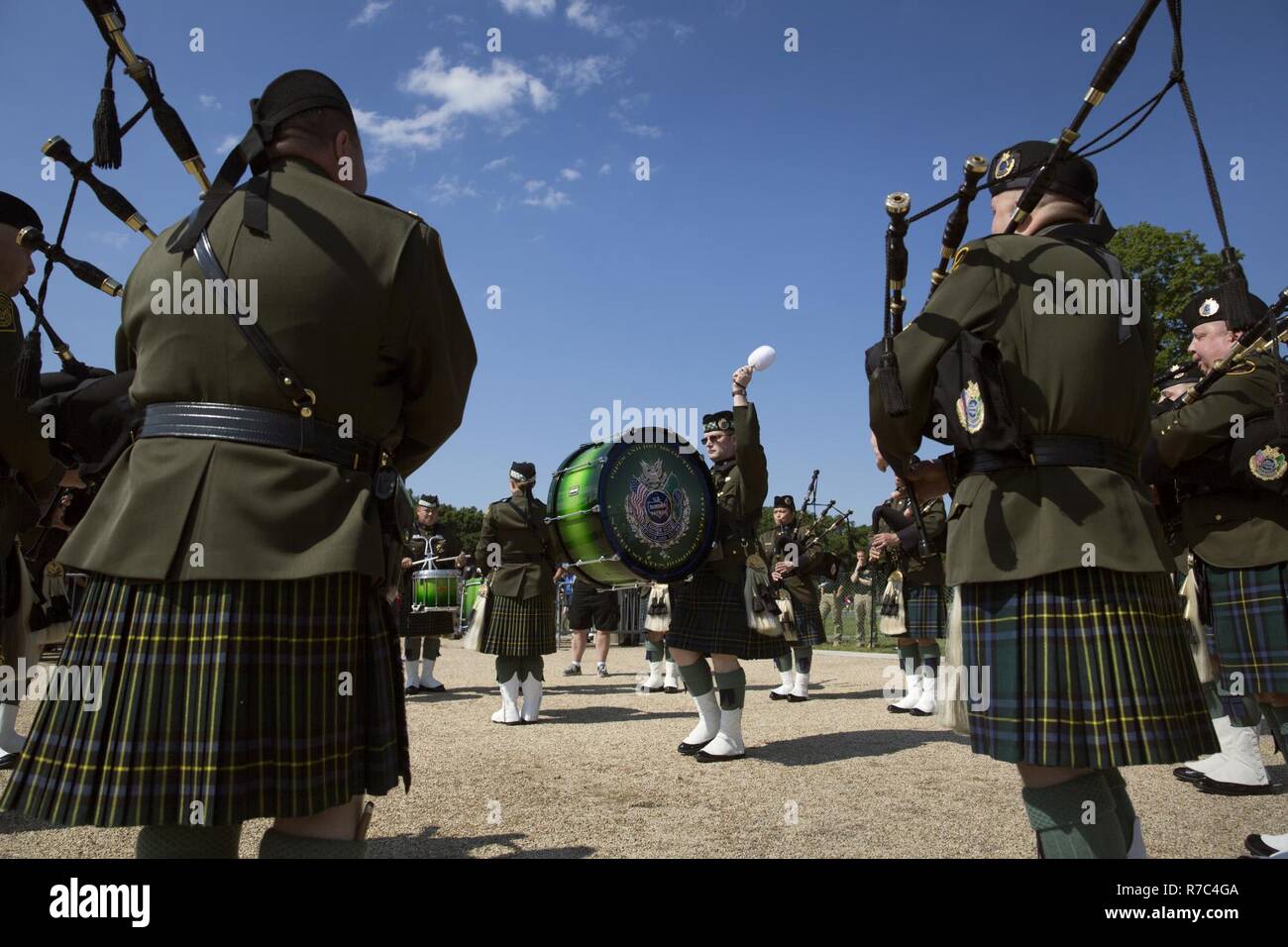 Members of the U.S. Border Patrol Pipes and Drums perform during the
