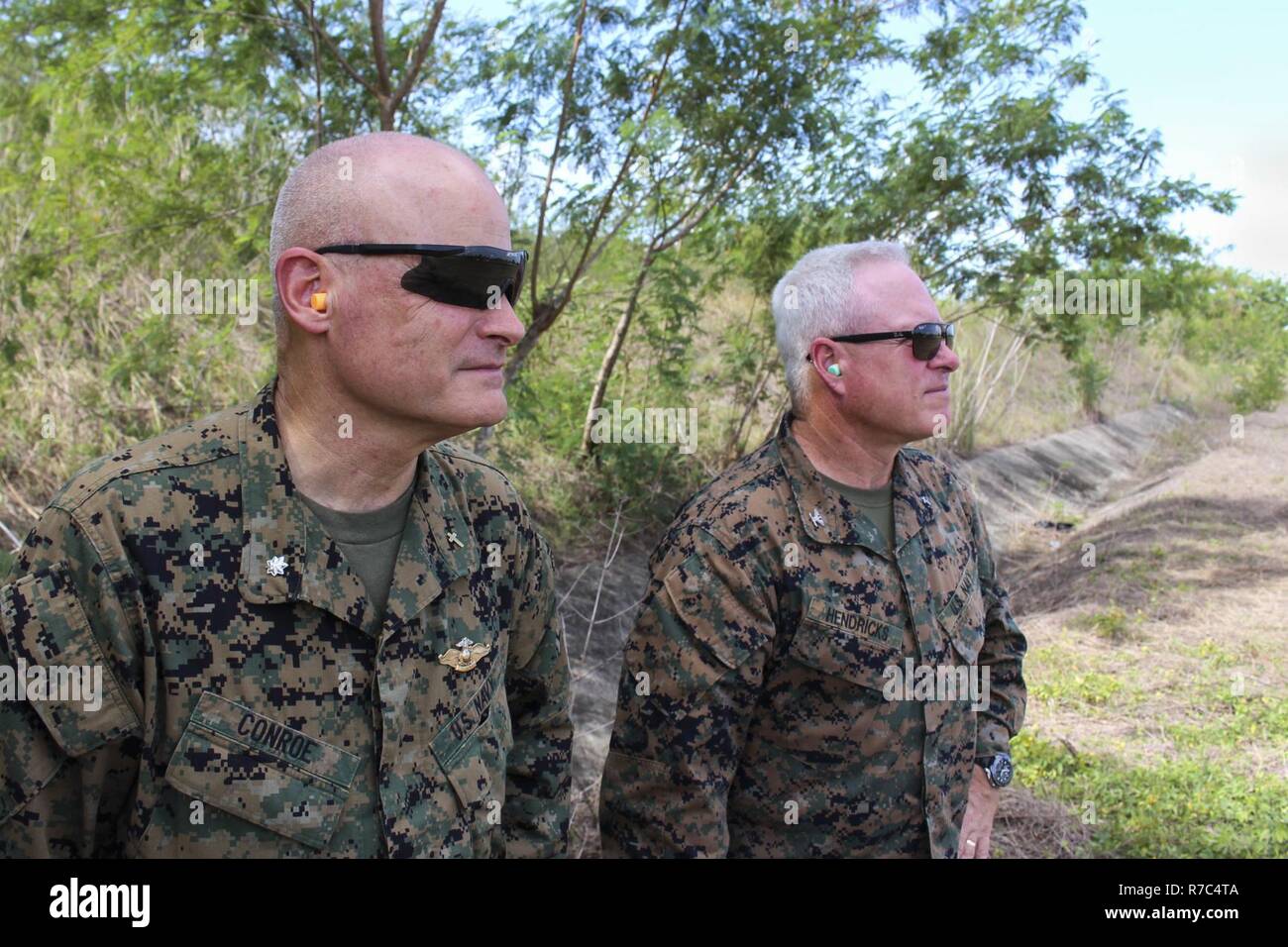 https://c8.alamy.com/comp/R7C4TA/us-navy-cmdr-jon-conroe-deputy-force-chaplain-us-marine-corps-forces-pacific-marforpac-and-capt-mark-hendricks-force-chaplain-marforpac-wait-for-a-uh-60-black-hawk-helicopter-before-flying-to-a-community-relations-event-in-support-of-balikatan-2017-at-fort-magsaysay-in-santa-rosa-nueva-ecija-may-13-2017-balikatan-is-an-annual-us-philippine-bilateral-military-exercise-focused-on-a-variety-of-missions-including-humanitarian-and-disaster-relief-counterterrorism-and-other-combined-military-operations-R7C4TA.jpg