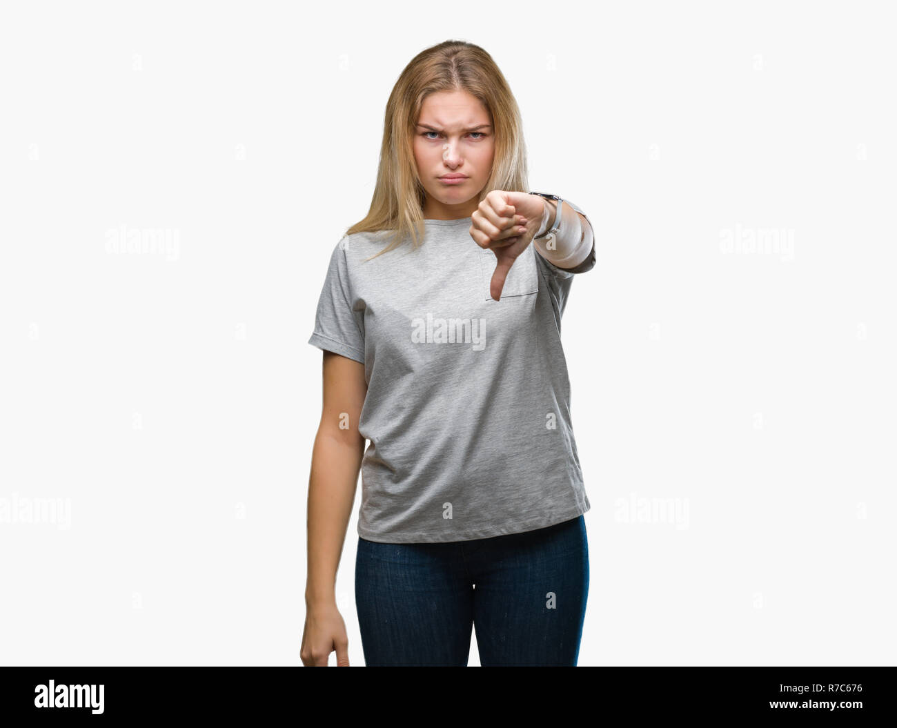 Young caucasian woman over isolated background looking unhappy and ...
