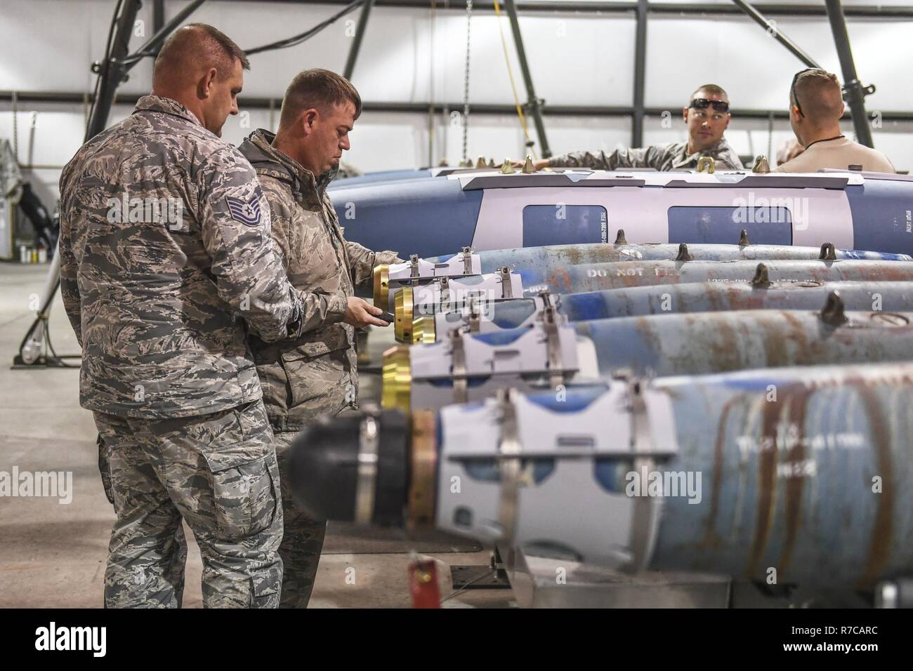 Active-duty Tech. Sgts. Mike McKinney, foreground, and James Underwood, both 301st Fighter Wing, Naval Air Station Fort Worth Joint Reserve Base, Texas, build GBU-38 and GBU-54 bombs April 26 at Hill Air Force Base, Utah. McKinney and Underwood participated in Combat Hammer, an air-to-ground weapons evaluation exercise which collects and analyzes data on the performance of precision weapons and measures their suitability for use in combat. Stock Photo