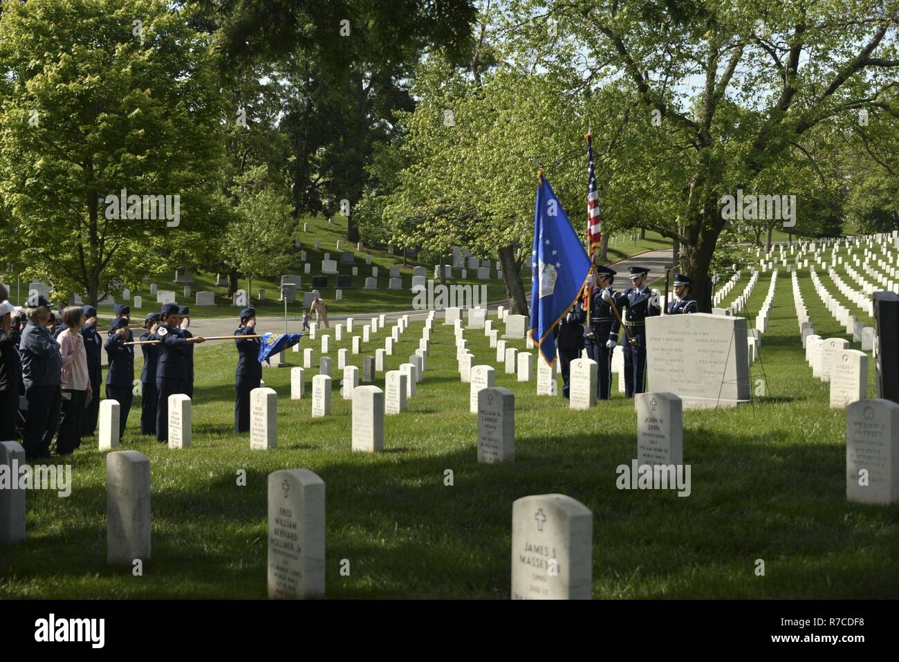 Airmen from the 94th Intelligence Squadron, U.S. Vietnam Veterans and guests stand as Taps is played during the BARON 52 wreath laying ceremony May 10, 2017. Stock Photo