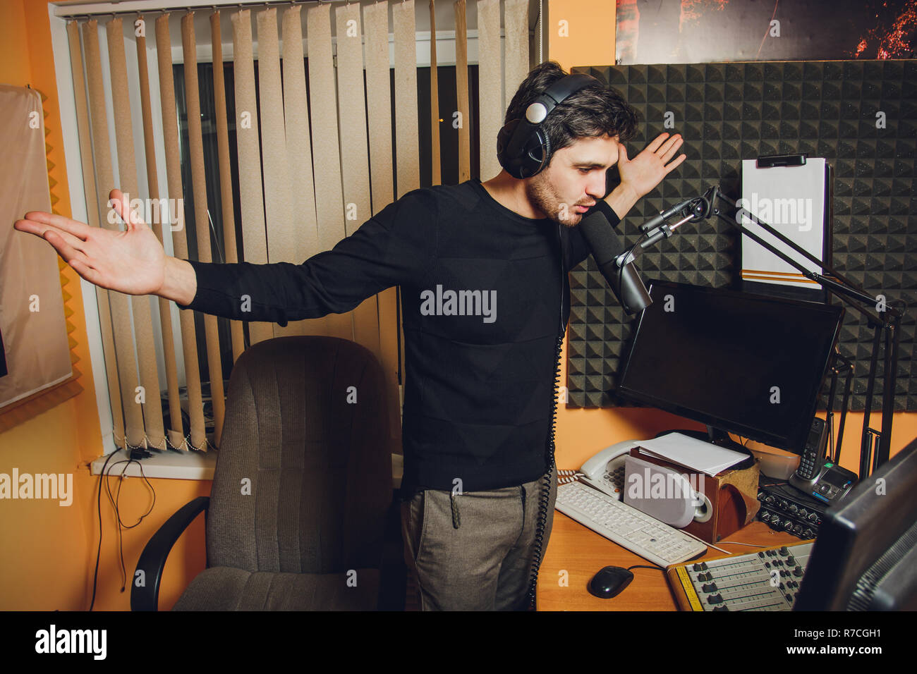 Microphone in radio studio and presenter on background Stock Photo Alamy