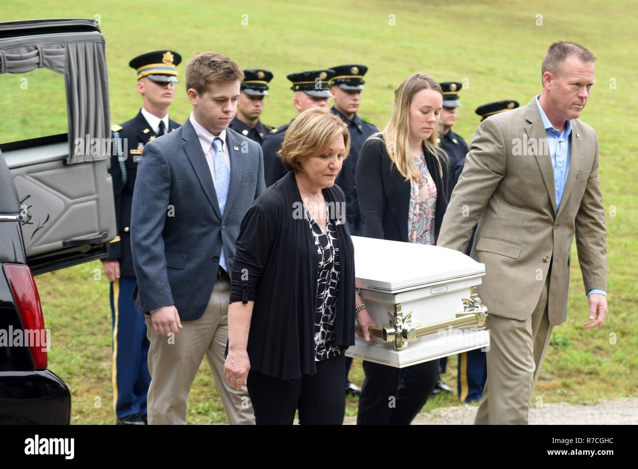 Descendents of Revolutionary War Private Samuel Howard carry the remains of his daughter (unnamed but referred to as Baby Howard) during a reinternment ceremony May 12, 2017 at Resthaven Cemetery in Baxter, Ky.  The U.S. Army Corps of Engineers Nashville District worked with local community and state officials to move Howard, his wife Chloe, and Baby Howard from Wix-Howard Cemetery when the graves were endangered by soil movement from a design deficiency of a flood control project completed in the 1990s. Stock Photo