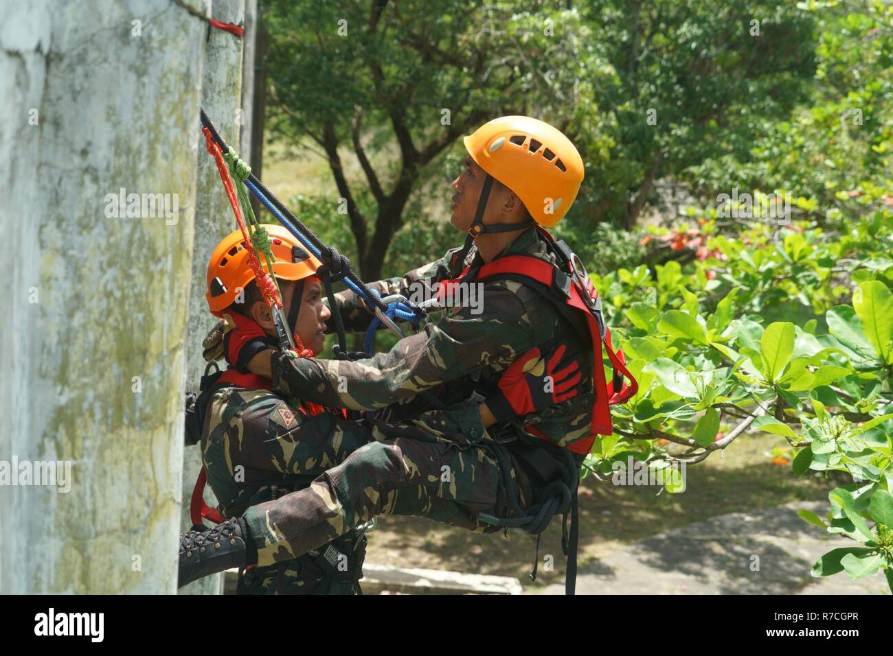 Members of the Armed Forces of the Philippines perform a patient rope ...