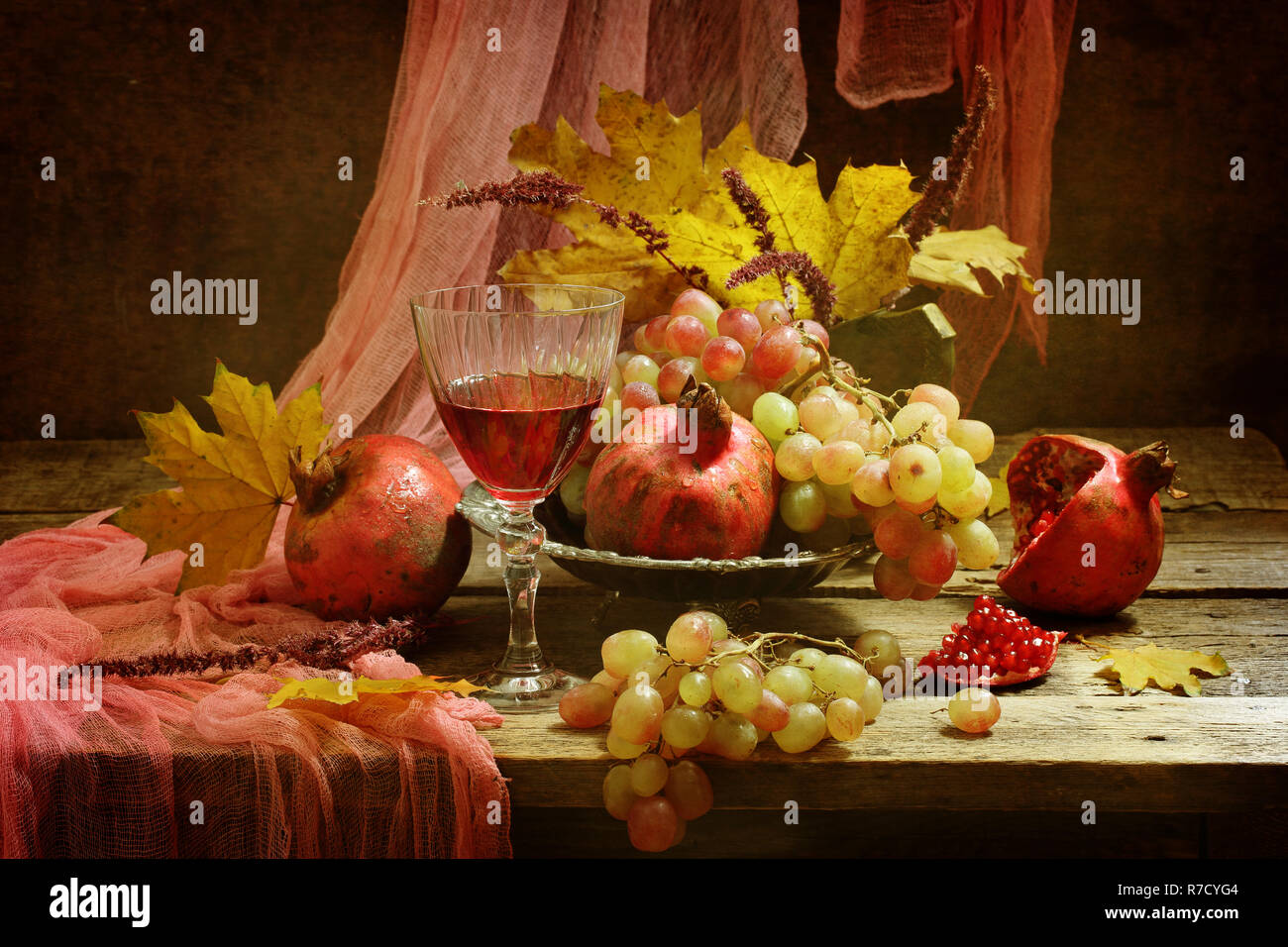 Still-life with a glass of red wine and fruit Stock Photo - Alamy