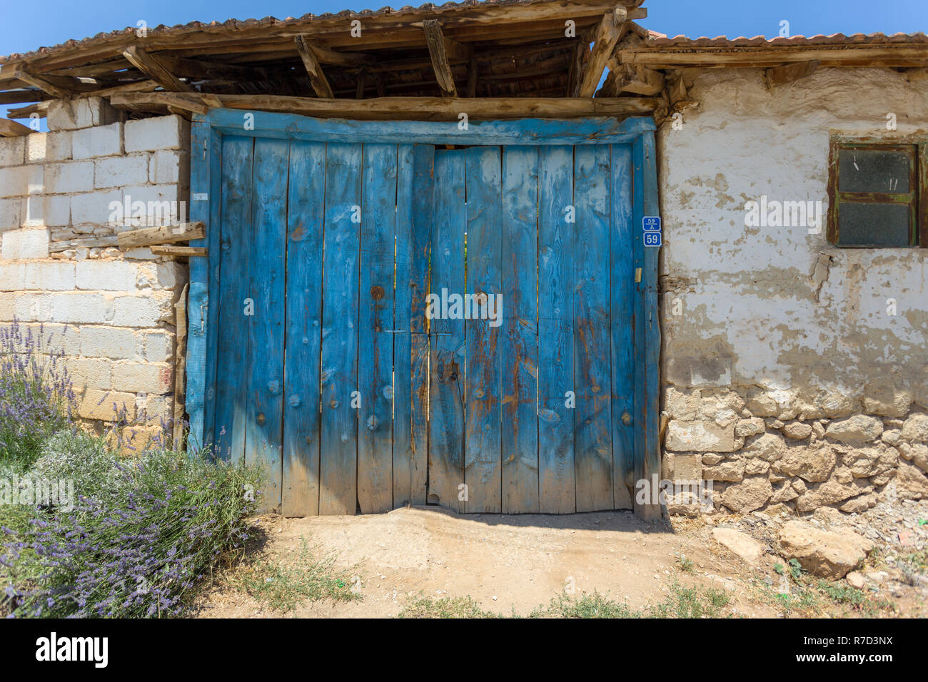 old house and old blue door Stock Photo - Alamy