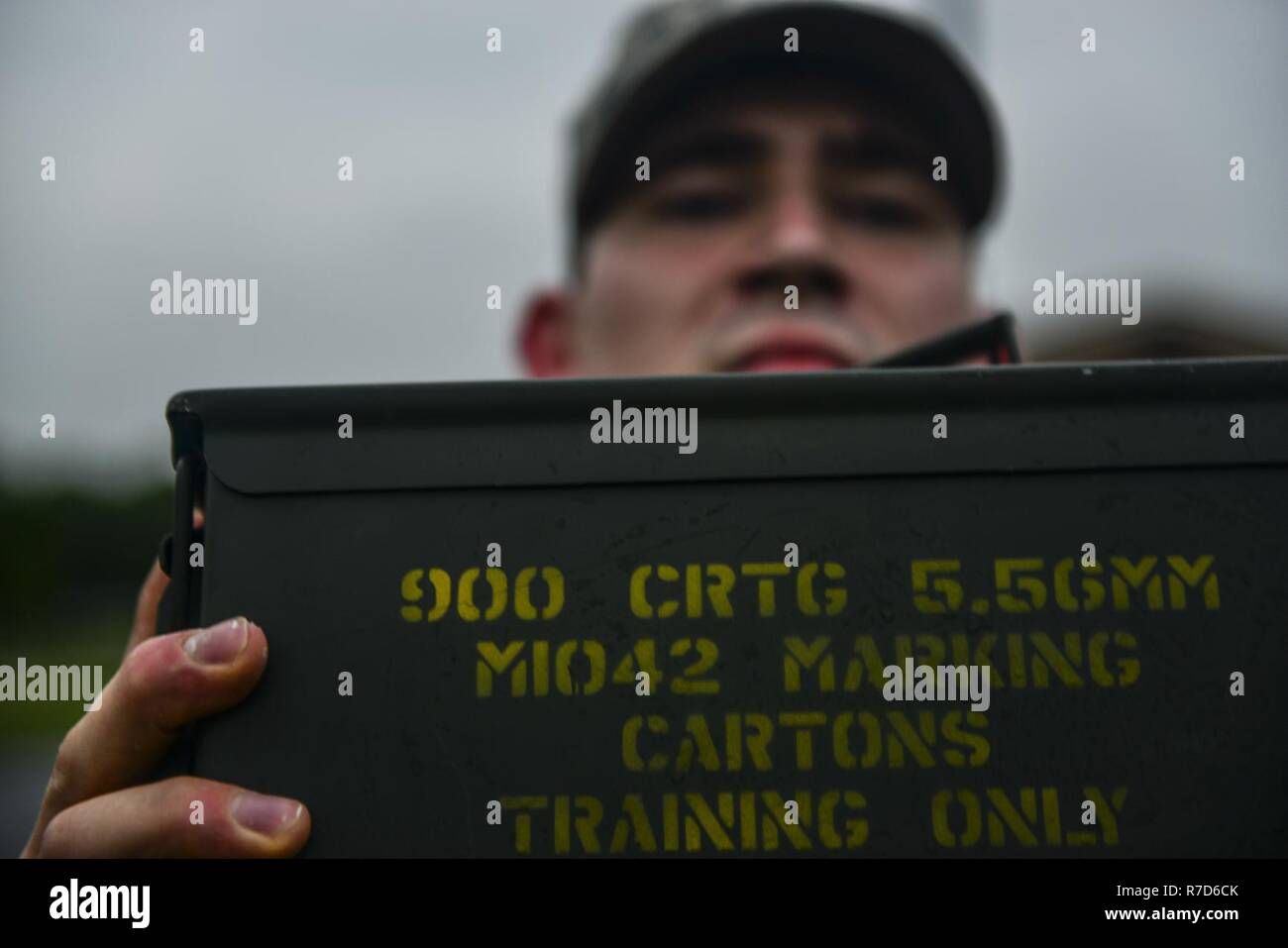 U.S. Air Force Staff Sgt. Jonathan Scott, 633rd Security Forces Squadron bravo flight response force leader, performs ammunition can presses during a training evolution at Joint Base Langley-Eustis, Va., April 28, 2017. Scott is a member of 633rd SFS Emergency Services Team, equivalent to a civilian police SWAT (Special Weapons and tactics) Team. Stock Photo