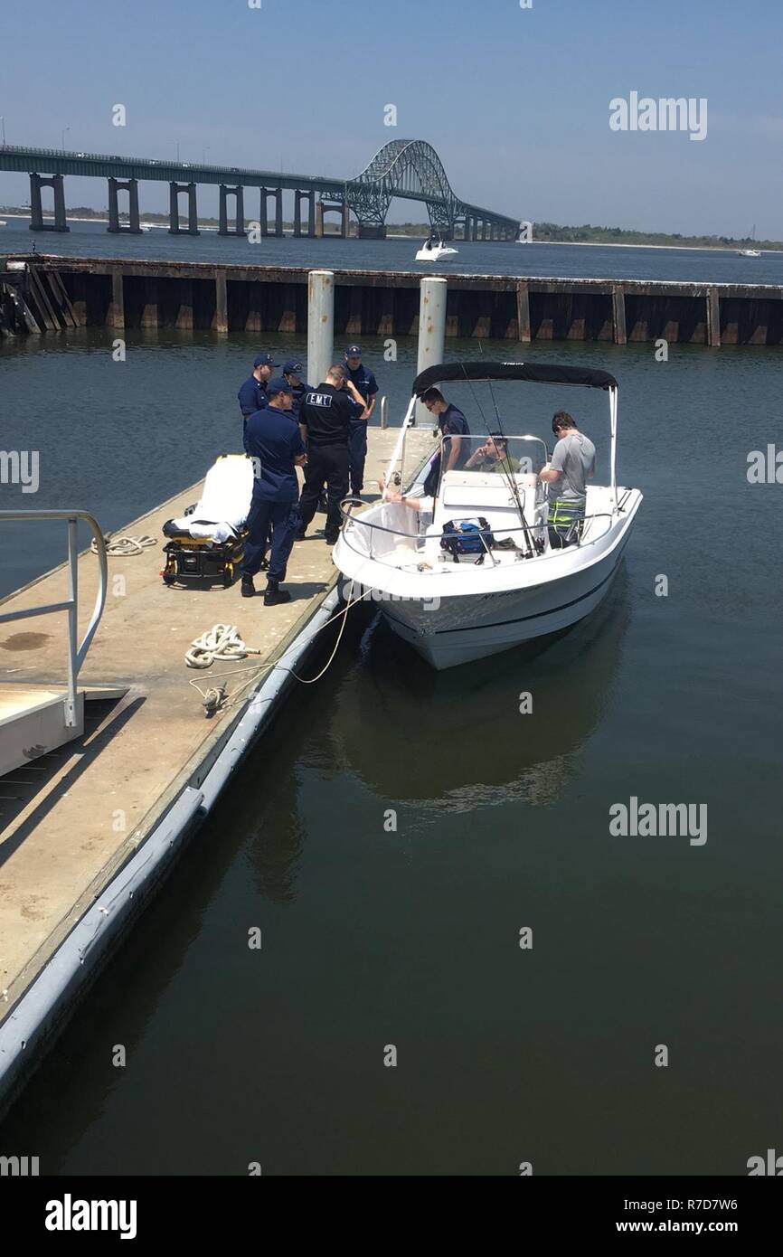 Coast Guard Station Fire Island crewmembers administer first aid to a